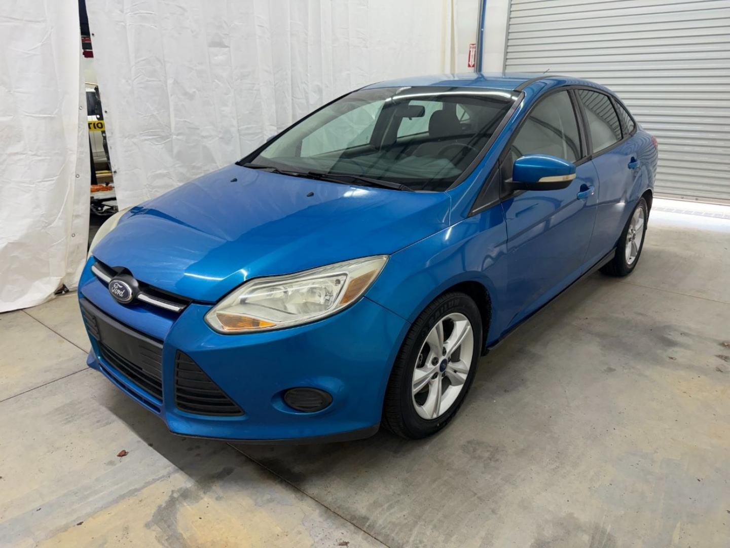 2014 Blue Ford Focus SE (1FADP3F20EL) with an 2L I-4 gasoline direct injection engine, located at 1806 Veterans Memorial Hwy SW, Austell, GA, 30168, (770) 944-9558, 33.817959, -84.606987- Photo#0