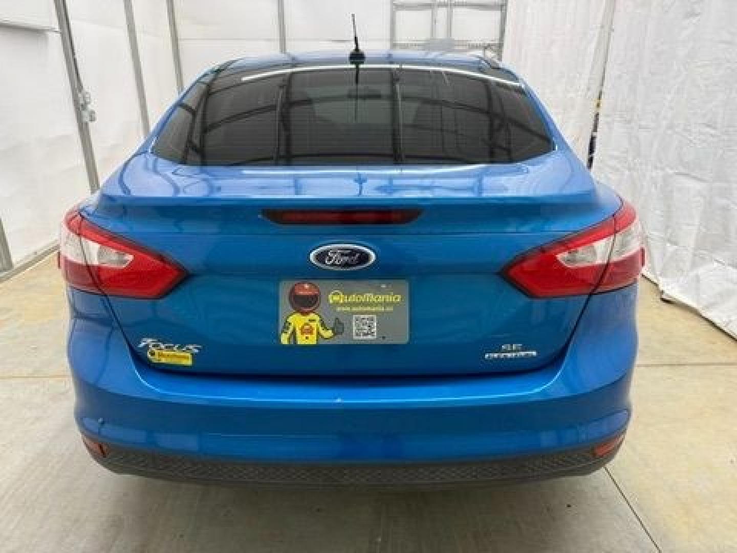 2014 Blue Ford Focus SE (1FADP3F20EL) with an 2L I-4 gasoline direct injection engine, located at 1806 Veterans Memorial Hwy SW, Austell, GA, 30168, (770) 944-9558, 33.817959, -84.606987- Photo#4