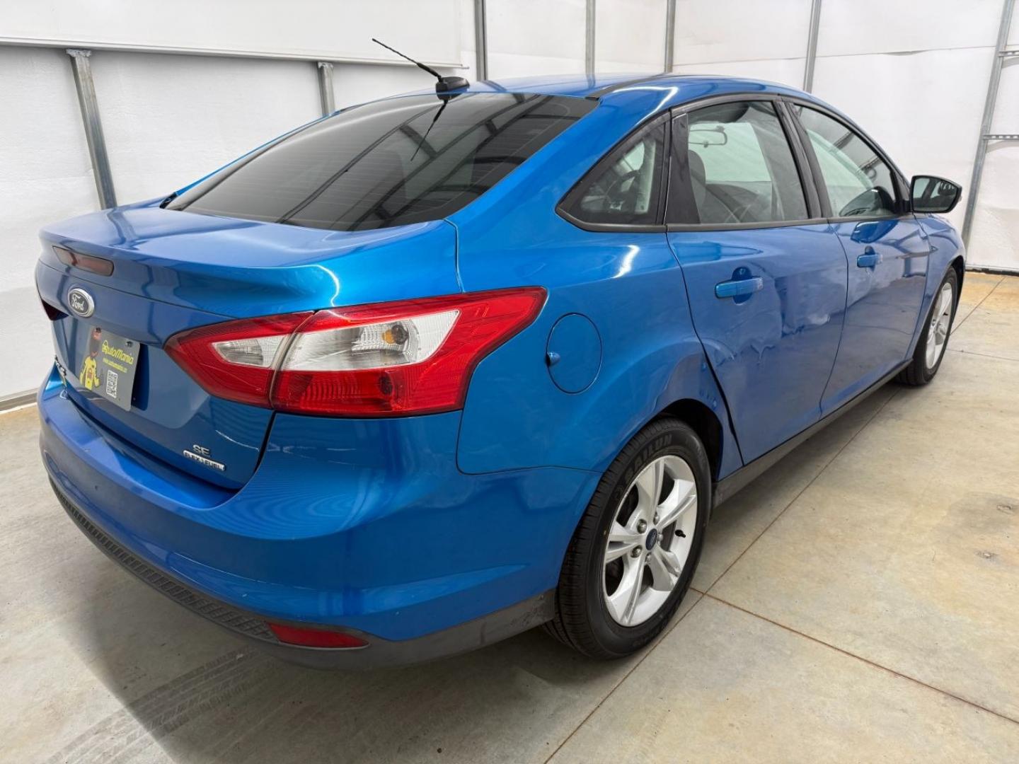 2014 Blue Ford Focus SE (1FADP3F20EL) with an 2L I-4 gasoline direct injection engine, located at 1806 Veterans Memorial Hwy SW, Austell, GA, 30168, (770) 944-9558, 33.817959, -84.606987- Photo#5