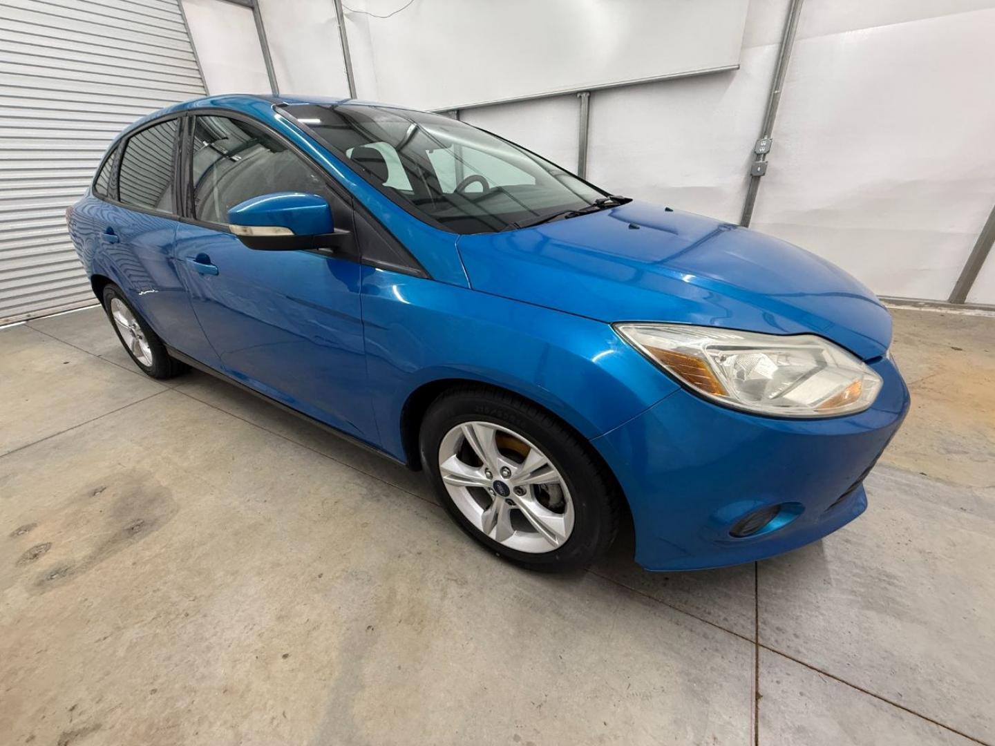 2014 Blue Ford Focus SE (1FADP3F20EL) with an 2L I-4 gasoline direct injection engine, located at 1806 Veterans Memorial Hwy SW, Austell, GA, 30168, (770) 944-9558, 33.817959, -84.606987- Photo#7