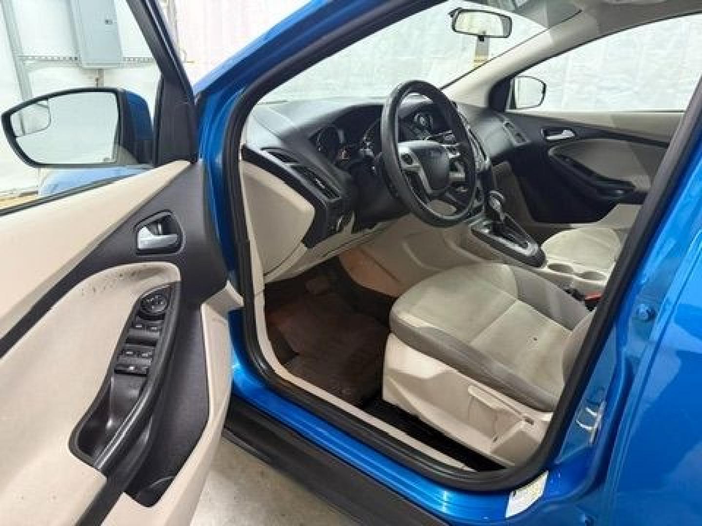 2014 Blue Ford Focus SE (1FADP3F20EL) with an 2L I-4 gasoline direct injection engine, located at 1806 Veterans Memorial Hwy SW, Austell, GA, 30168, (770) 944-9558, 33.817959, -84.606987- Photo#10