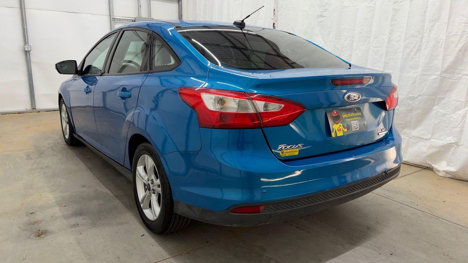 2014 Blue Ford Focus SE (1FADP3F20EL) with an 2L I-4 gasoline dire engine, located at 1806 Veterans Memorial Hwy SW, Austell, GA, 30168, (770) 944-9558, 33.817959, -84.606987- Photo#3