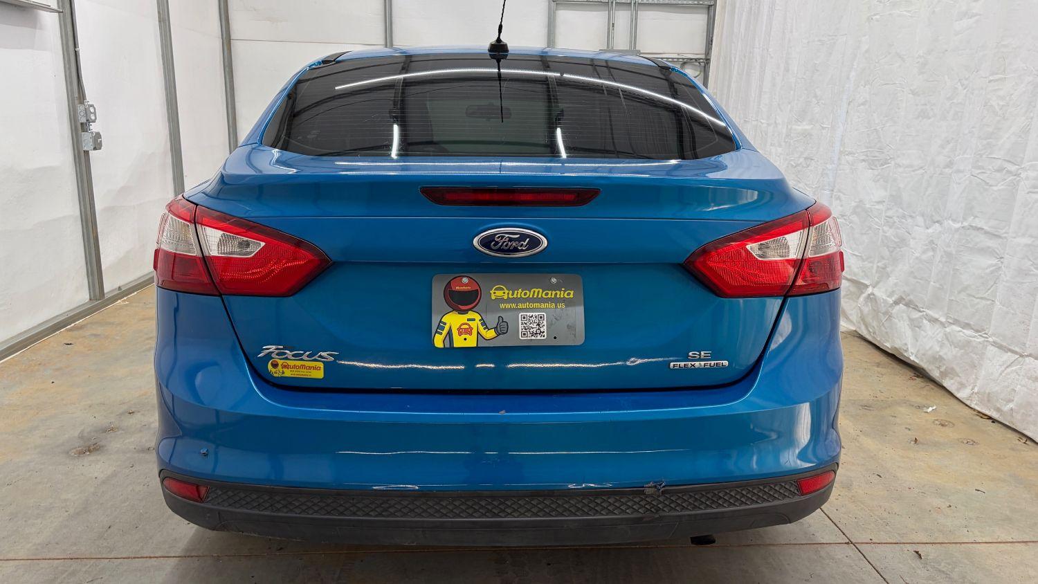 2014 Blue Ford Focus SE (1FADP3F20EL) with an 2L I-4 gasoline dire engine, located at 1806 Veterans Memorial Hwy SW, Austell, GA, 30168, (770) 944-9558, 33.817959, -84.606987- Photo#4