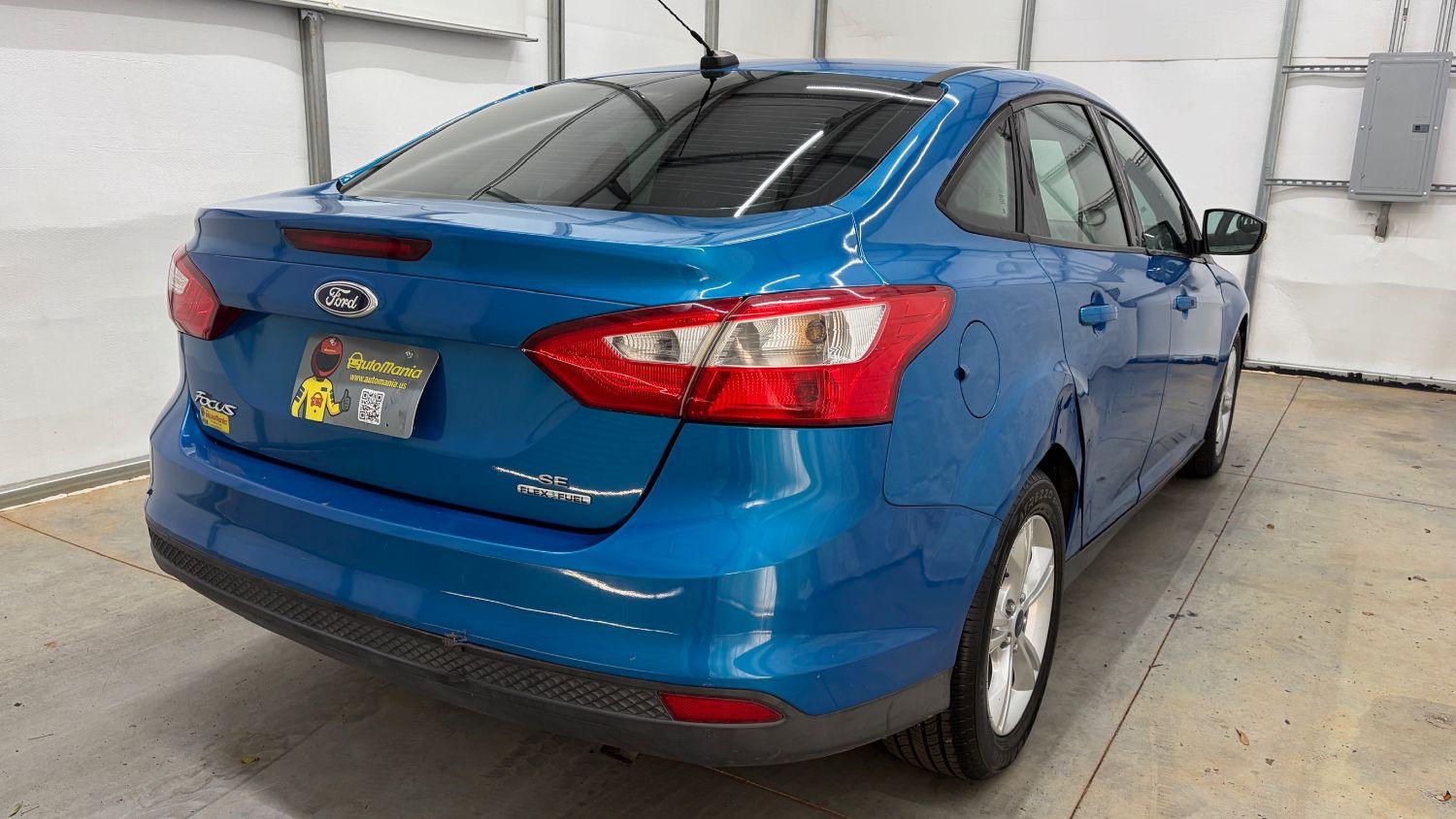2014 Blue Ford Focus SE (1FADP3F20EL) with an 2L I-4 gasoline dire engine, located at 1806 Veterans Memorial Hwy SW, Austell, GA, 30168, (770) 944-9558, 33.817959, -84.606987- Photo#5