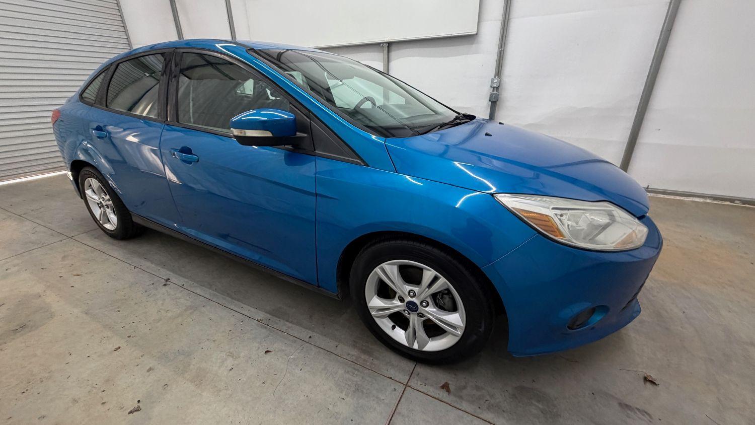 2014 Blue Ford Focus SE (1FADP3F20EL) with an 2L I-4 gasoline dire engine, located at 1806 Veterans Memorial Hwy SW, Austell, GA, 30168, (770) 944-9558, 33.817959, -84.606987- Photo#7