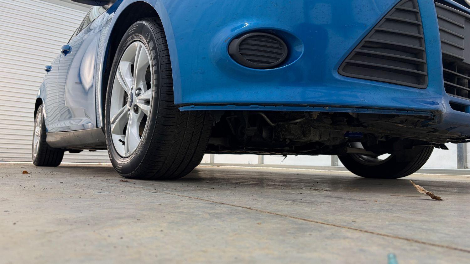 2014 Blue Ford Focus SE (1FADP3F20EL) with an 2L I-4 gasoline dire engine, located at 1806 Veterans Memorial Hwy SW, Austell, GA, 30168, (770) 944-9558, 33.817959, -84.606987- Photo#13