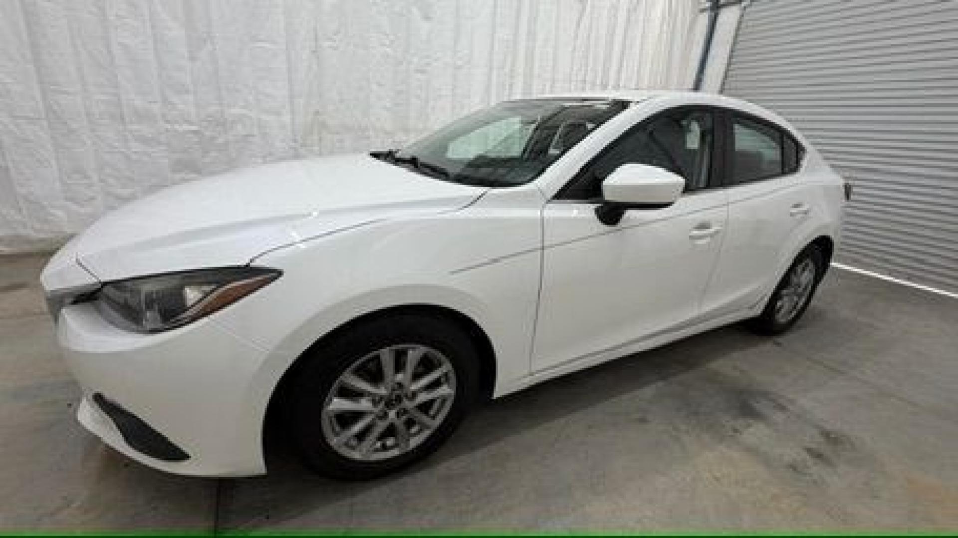 2014 White Mazda Mazda3 i Grand Touring (JM1BM1W75E1) with an SKYACTIV-G 2L I-4 gasoline direct injection engine, located at 1806 Veterans Memorial Hwy SW, Austell, GA, 30168, (770) 944-9558, 33.817959, -84.606987- Photo#1