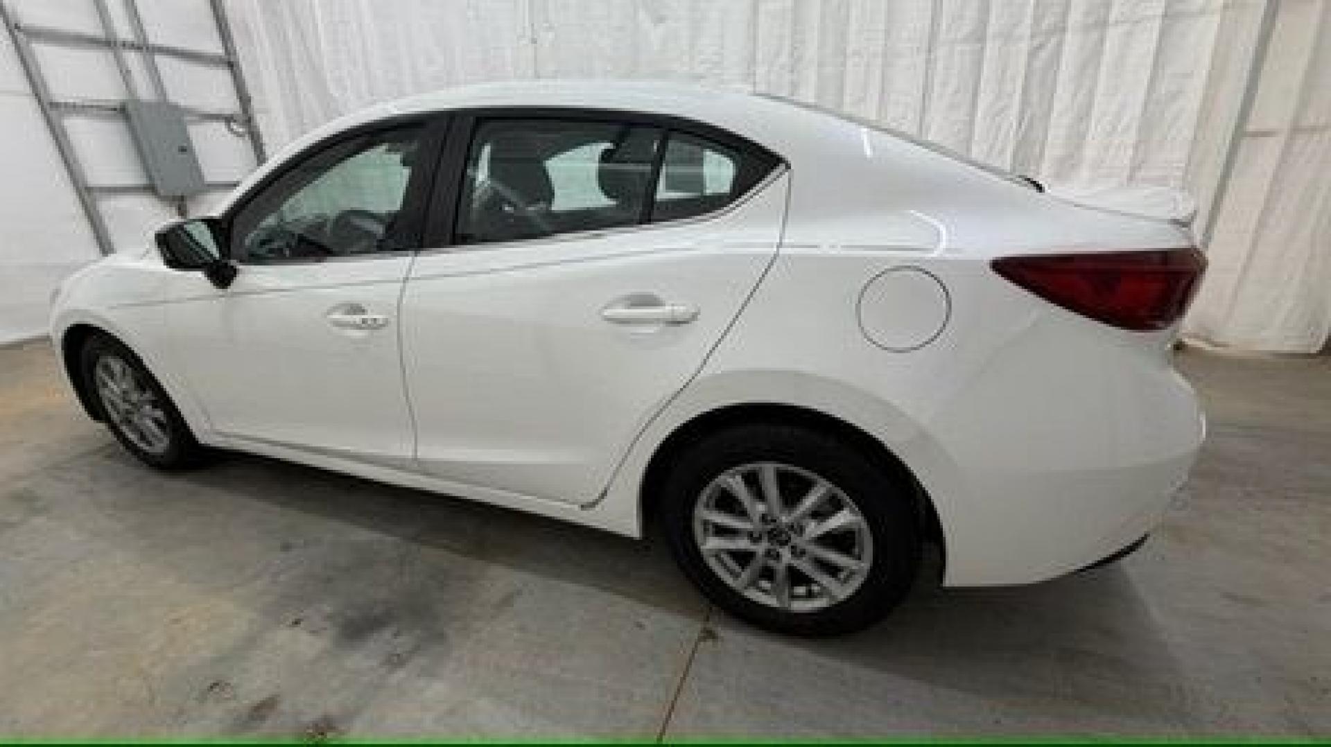 2014 White Mazda Mazda3 i Grand Touring (JM1BM1W75E1) with an SKYACTIV-G 2L I-4 gasoline direct injection engine, located at 1806 Veterans Memorial Hwy SW, Austell, GA, 30168, (770) 944-9558, 33.817959, -84.606987- Photo#2