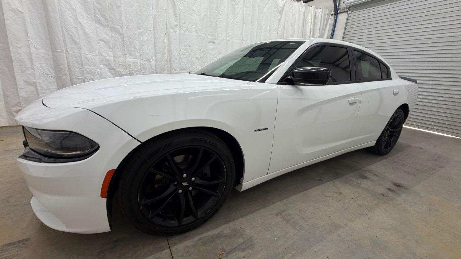 2017 White Dodge Charger R/T RWD (2C3CDXCT1HH) with an HEMI 5.7L V-8 regula engine, located at 1806 Veterans Memorial Hwy SW, Austell, GA, 30168, (770) 944-9558, 33.817959, -84.606987 - This 2017 Dodge Charger R/T delivers serious muscle-sedan performance wrapped in a clean White exterior. Under the hood is a powerful 370-hp 5.7L HEMI V8 paired with a smooth automatic transmission and rear-wheel drive, giving you the aggressive acceleration and confident handling the R/T trim is kn- Photo#1