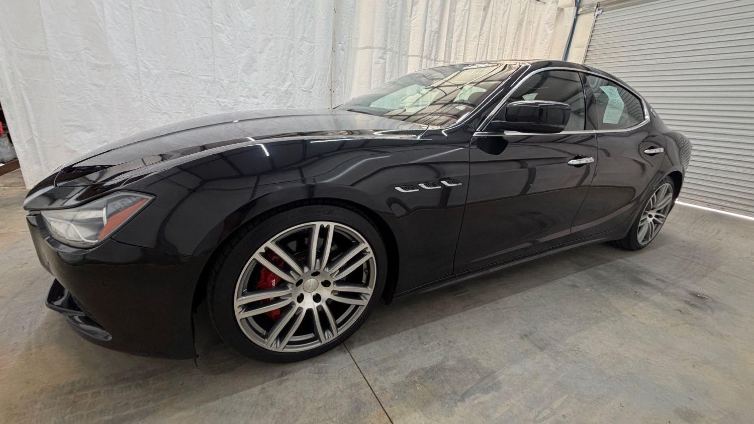 2015 Black Maserati Ghibli S Q4 (ZAM57RTA8F1) with an 3L V-6 gasoline direct injection engine, located at 1806 Veterans Memorial Hwy SW, Austell, GA, 30168, (770) 944-9558, 33.817959, -84.606987- Photo#1