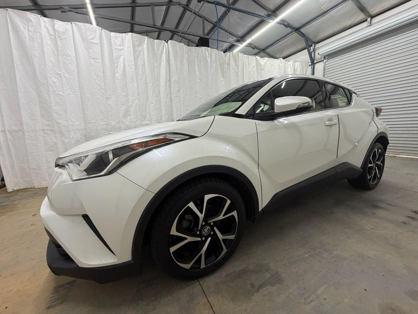 2019 White Toyota C-HR Limited (JTNKHMBX8K1) with an 2L I-4 DOHC engine, located at 1806 Veterans Memorial Hwy SW, Austell, GA, 30168, (770) 944-9558, 33.817959, -84.606987- Photo#1