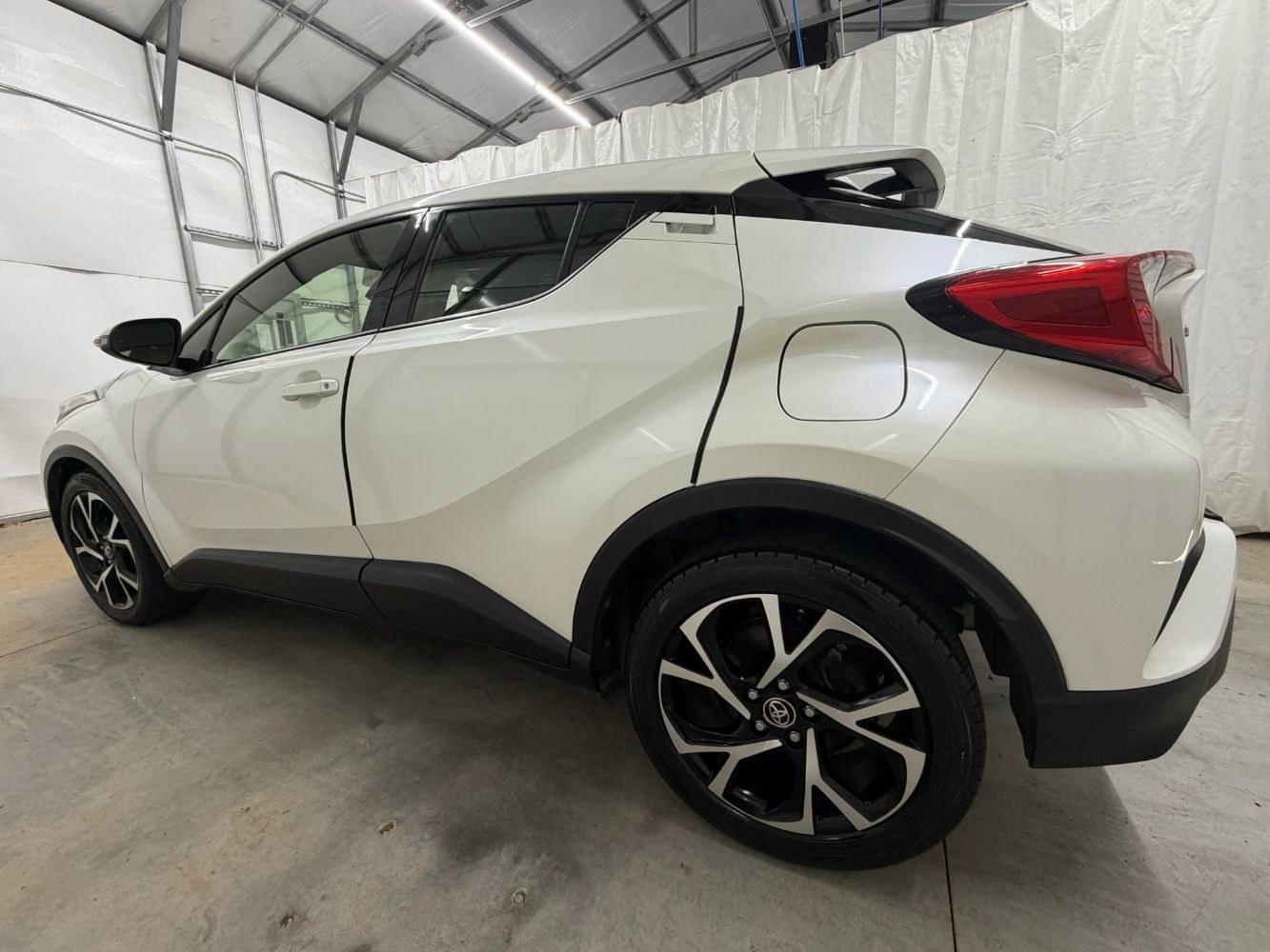 2019 White Toyota C-HR Limited (JTNKHMBX8K1) with an 2L I-4 DOHC engine, located at 1806 Veterans Memorial Hwy SW, Austell, GA, 30168, (770) 944-9558, 33.817959, -84.606987- Photo#2