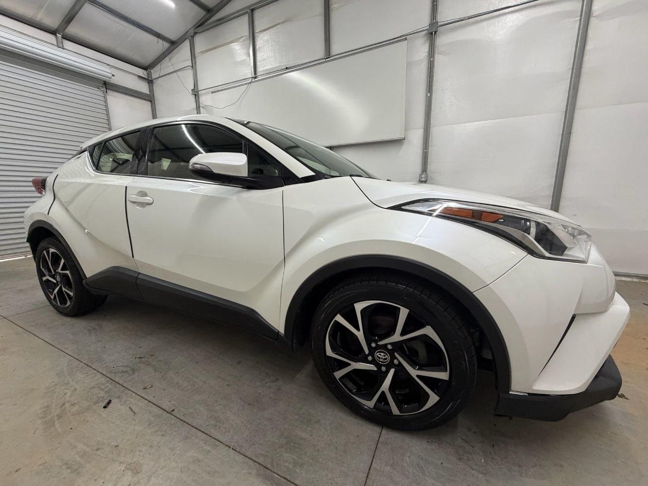 2019 White Toyota C-HR Limited (JTNKHMBX8K1) with an 2L I-4 DOHC engine, located at 1806 Veterans Memorial Hwy SW, Austell, GA, 30168, (770) 944-9558, 33.817959, -84.606987- Photo#7