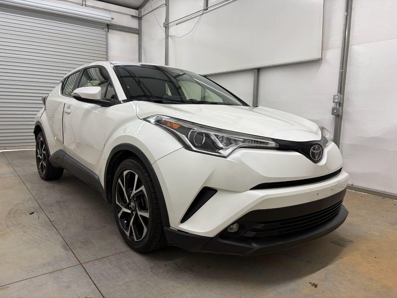 2019 White Toyota C-HR Limited (JTNKHMBX8K1) with an 2L I-4 DOHC engine, located at 1806 Veterans Memorial Hwy SW, Austell, GA, 30168, (770) 944-9558, 33.817959, -84.606987- Photo#8
