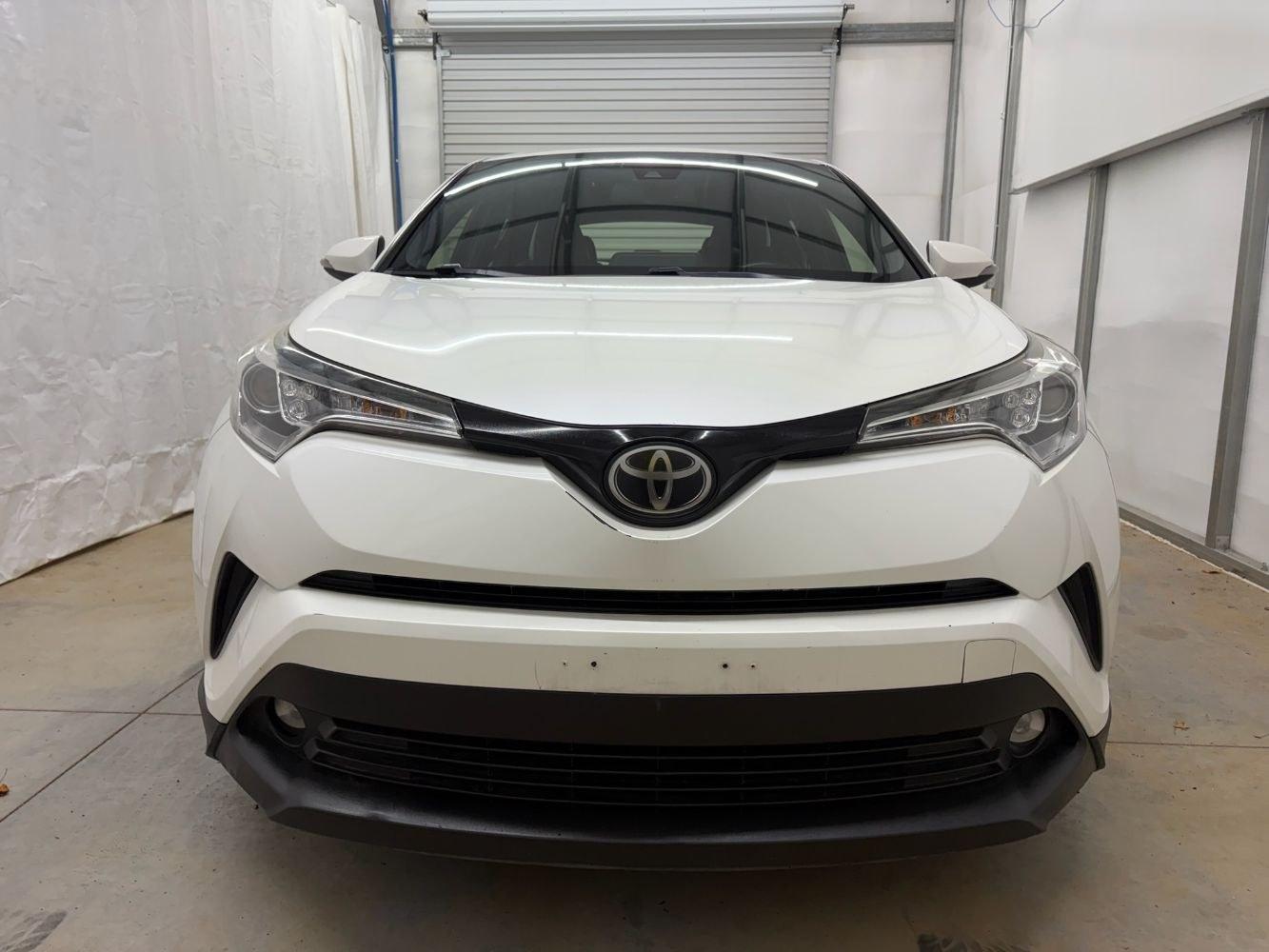 2019 White Toyota C-HR Limited (JTNKHMBX8K1) with an 2L I-4 DOHC engine, located at 1806 Veterans Memorial Hwy SW, Austell, GA, 30168, (770) 944-9558, 33.817959, -84.606987- Photo#9