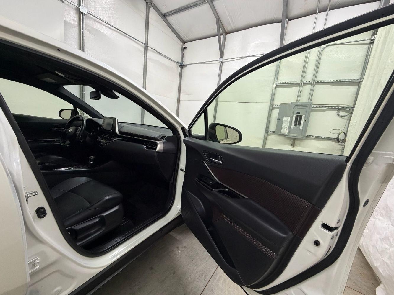 2019 White Toyota C-HR Limited (JTNKHMBX8K1) with an 2L I-4 DOHC engine, located at 1806 Veterans Memorial Hwy SW, Austell, GA, 30168, (770) 944-9558, 33.817959, -84.606987- Photo#16