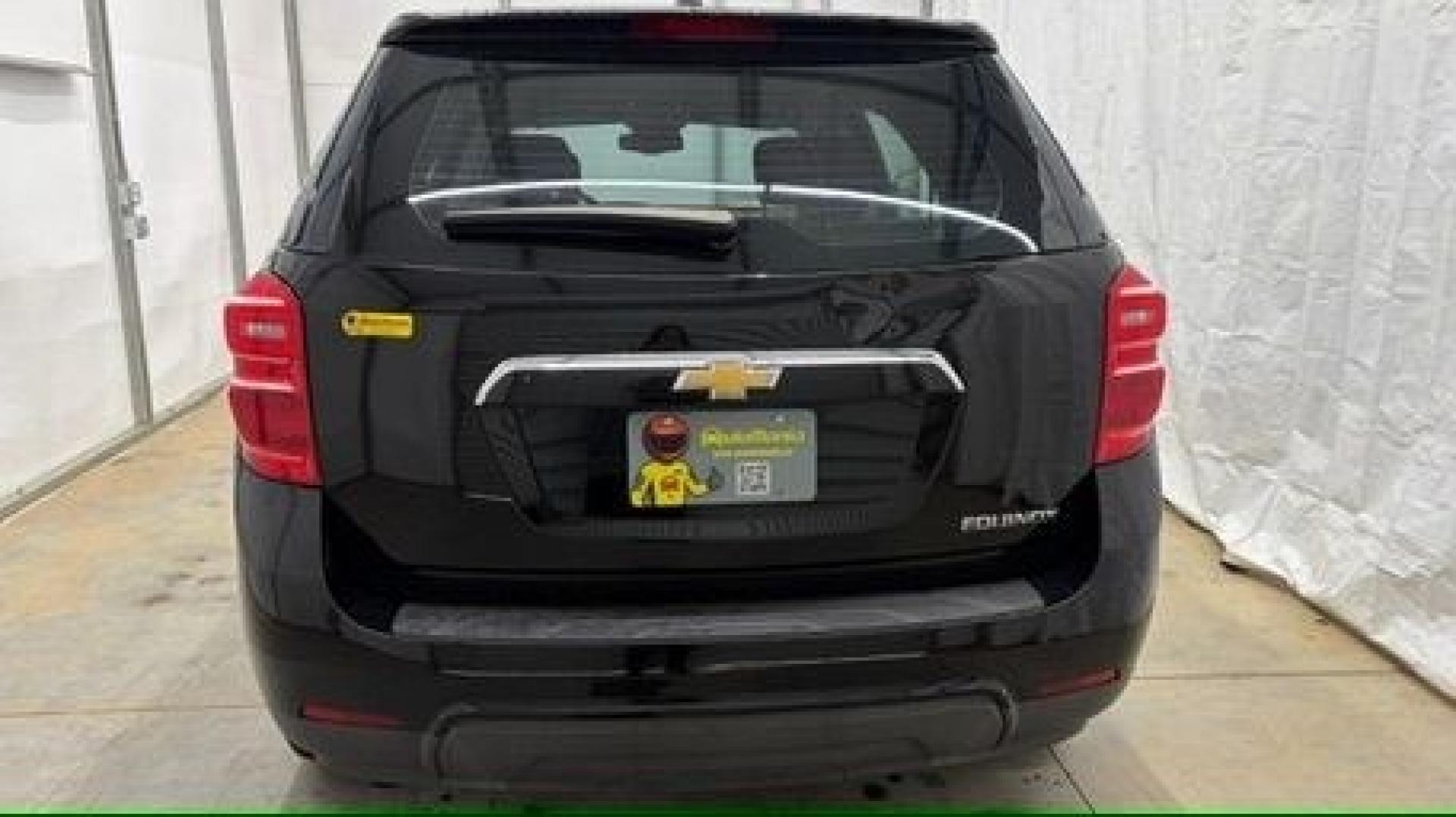 2016 Black Chevrolet Equinox LS (2GNALBEKXG1) with an ECOTEC 2.4L I-4 gasoline direct injection engine, located at 1806 Veterans Memorial Hwy SW, Austell, GA, 30168, (770) 944-9558, 33.817959, -84.606987- Photo#4