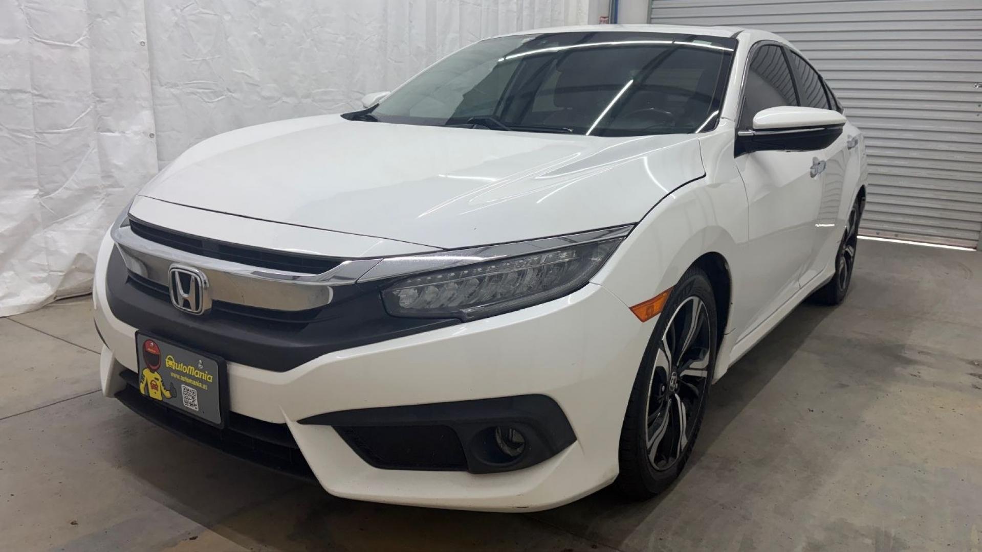 2016 White Honda Civic Touring (2HGFC1F93GH) with an 1.5L I-4 gasoline direct injection engine, located at 1806 Veterans Memorial Hwy SW, Austell, GA, 30168, (770) 944-9558, 33.817959, -84.606987- Photo#1