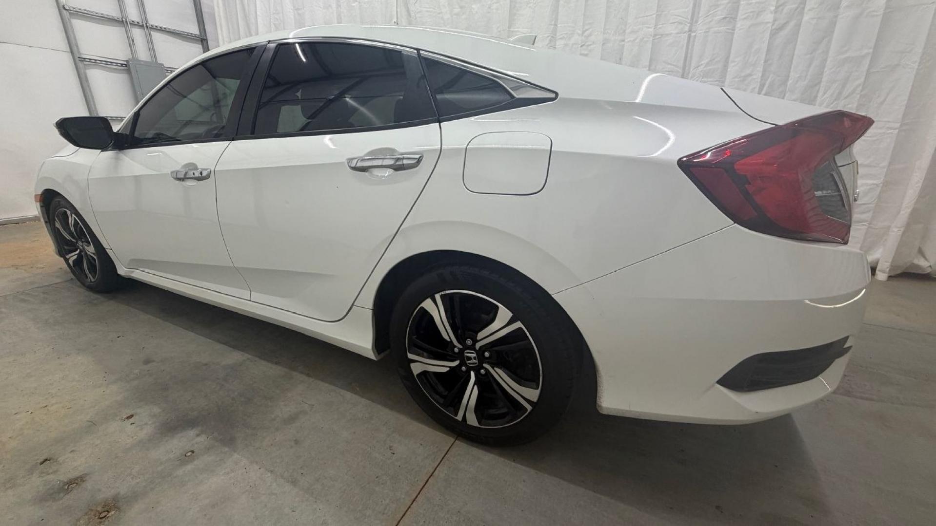 2016 White Honda Civic Touring (2HGFC1F93GH) with an 1.5L I-4 gasoline direct injection engine, located at 1806 Veterans Memorial Hwy SW, Austell, GA, 30168, (770) 944-9558, 33.817959, -84.606987- Photo#3