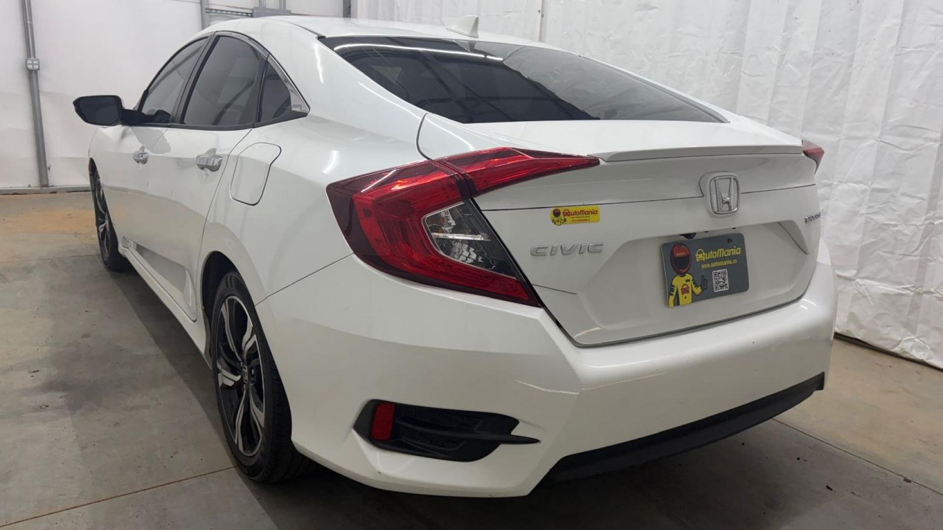 2016 White Honda Civic Touring (2HGFC1F93GH) with an 1.5L I-4 gasoline direct injection engine, located at 1806 Veterans Memorial Hwy SW, Austell, GA, 30168, (770) 944-9558, 33.817959, -84.606987- Photo#4