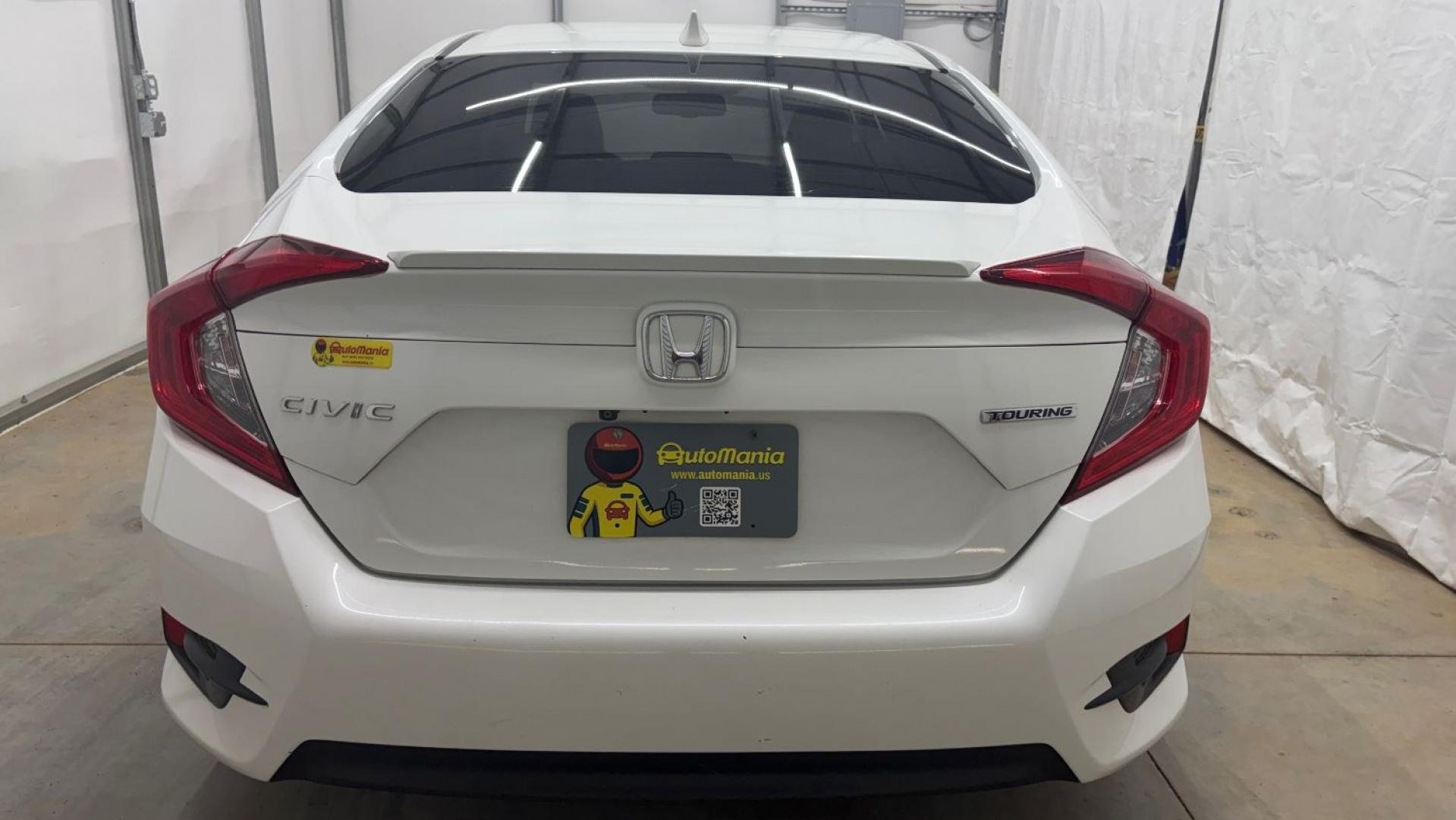 2016 White Honda Civic Touring (2HGFC1F93GH) with an 1.5L I-4 gasoline direct injection engine, located at 1806 Veterans Memorial Hwy SW, Austell, GA, 30168, (770) 944-9558, 33.817959, -84.606987- Photo#5