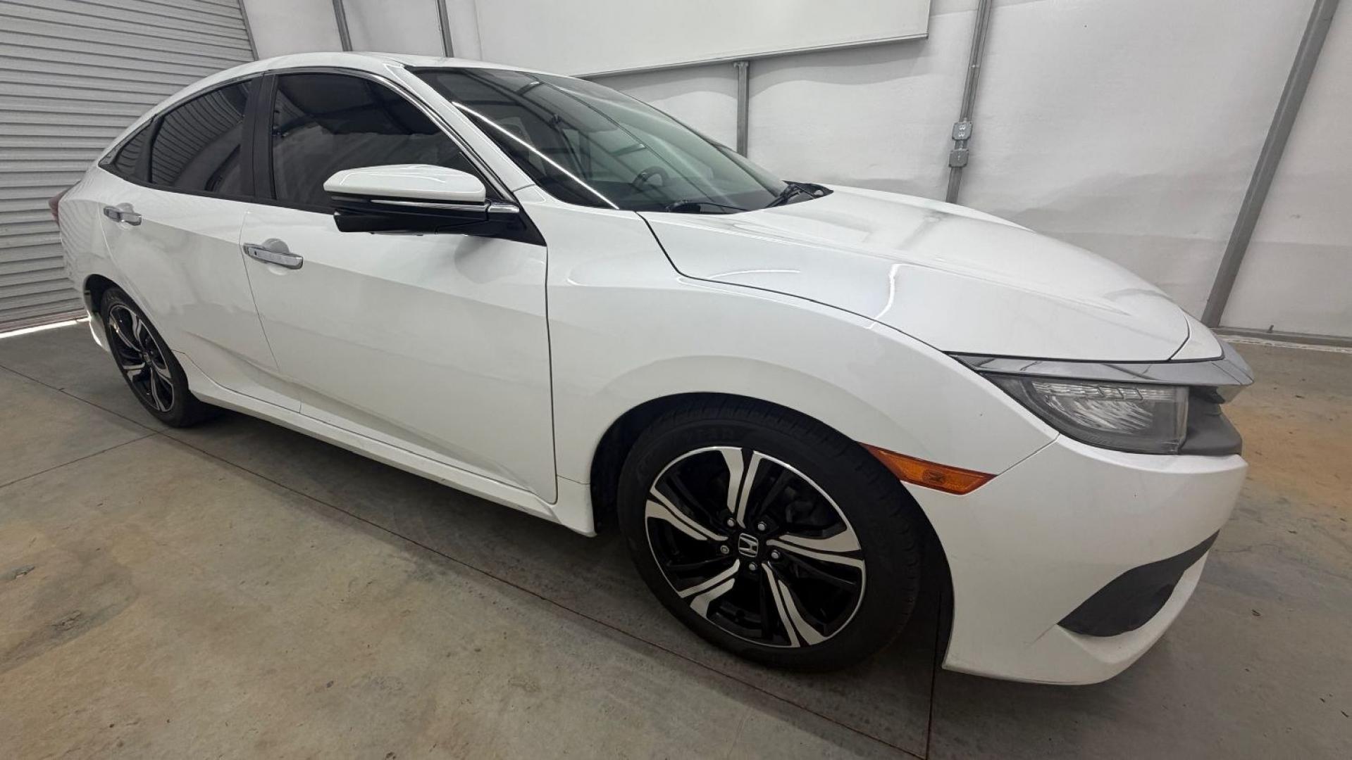 2016 White Honda Civic Touring (2HGFC1F93GH) with an 1.5L I-4 gasoline direct injection engine, located at 1806 Veterans Memorial Hwy SW, Austell, GA, 30168, (770) 944-9558, 33.817959, -84.606987- Photo#8