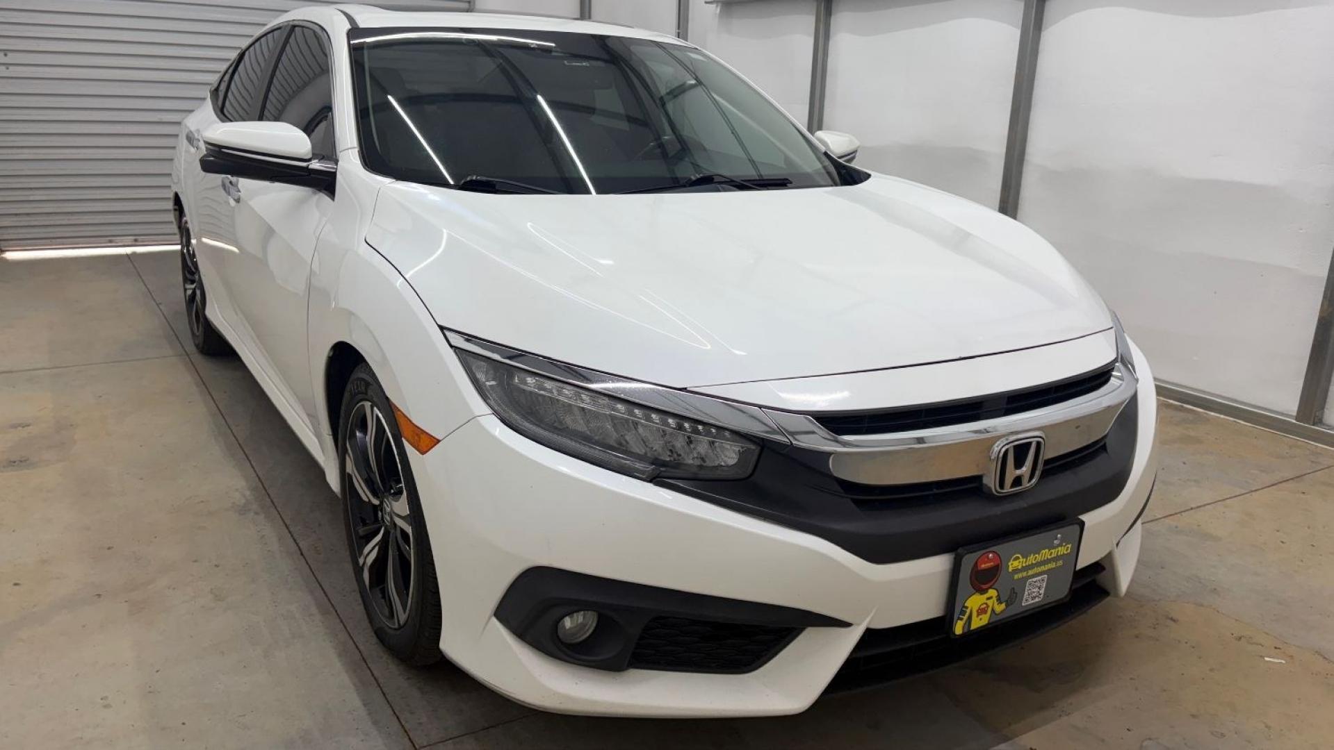 2016 White Honda Civic Touring (2HGFC1F93GH) with an 1.5L I-4 gasoline direct injection engine, located at 1806 Veterans Memorial Hwy SW, Austell, GA, 30168, (770) 944-9558, 33.817959, -84.606987- Photo#9