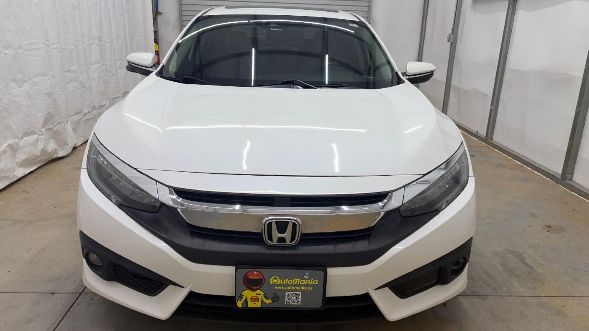 2016 White Honda Civic Touring (2HGFC1F93GH) with an 1.5L I-4 gasoline direct injection engine, located at 1806 Veterans Memorial Hwy SW, Austell, GA, 30168, (770) 944-9558, 33.817959, -84.606987- Photo#10