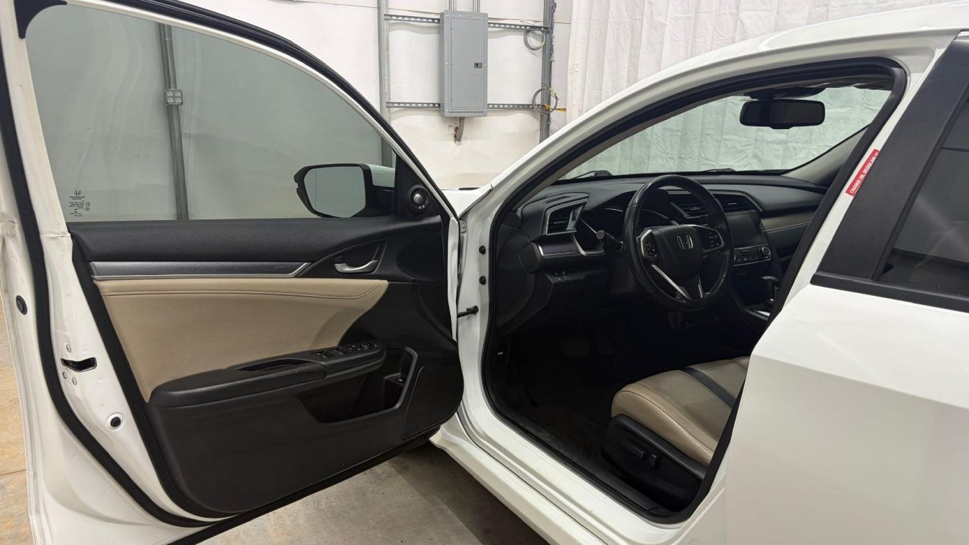 2016 White Honda Civic Touring (2HGFC1F93GH) with an 1.5L I-4 gasoline direct injection engine, located at 1806 Veterans Memorial Hwy SW, Austell, GA, 30168, (770) 944-9558, 33.817959, -84.606987- Photo#11