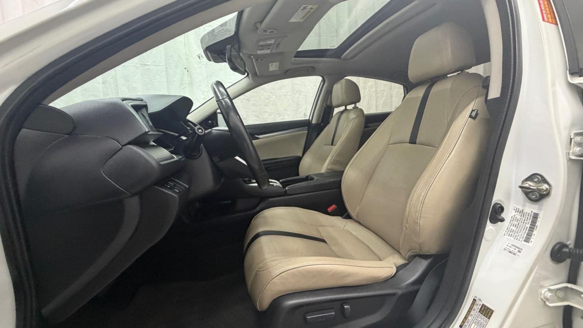 2016 White Honda Civic Touring (2HGFC1F93GH) with an 1.5L I-4 gasoline direct injection engine, located at 1806 Veterans Memorial Hwy SW, Austell, GA, 30168, (770) 944-9558, 33.817959, -84.606987- Photo#14