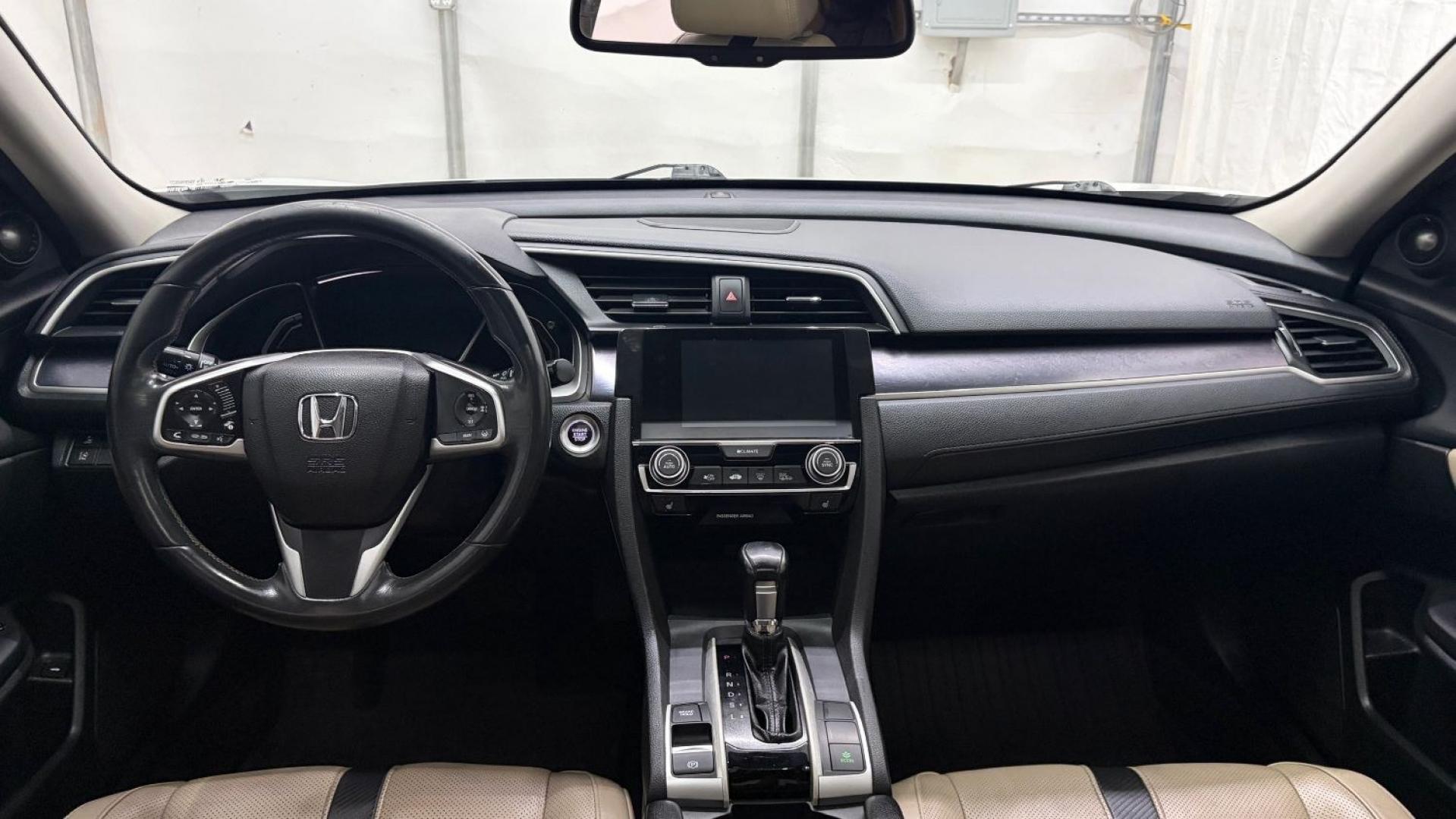 2016 White Honda Civic Touring (2HGFC1F93GH) with an 1.5L I-4 gasoline direct injection engine, located at 1806 Veterans Memorial Hwy SW, Austell, GA, 30168, (770) 944-9558, 33.817959, -84.606987- Photo#17