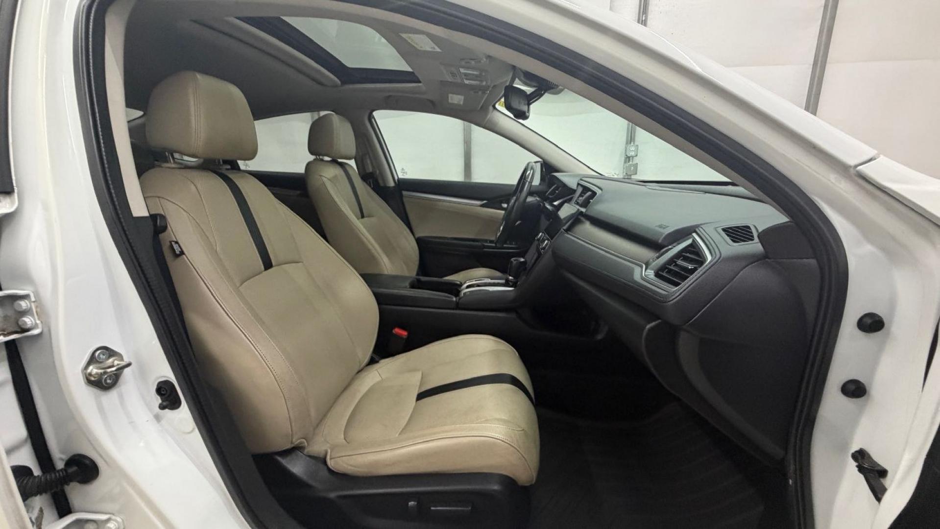 2016 White Honda Civic Touring (2HGFC1F93GH) with an 1.5L I-4 gasoline direct injection engine, located at 1806 Veterans Memorial Hwy SW, Austell, GA, 30168, (770) 944-9558, 33.817959, -84.606987- Photo#20