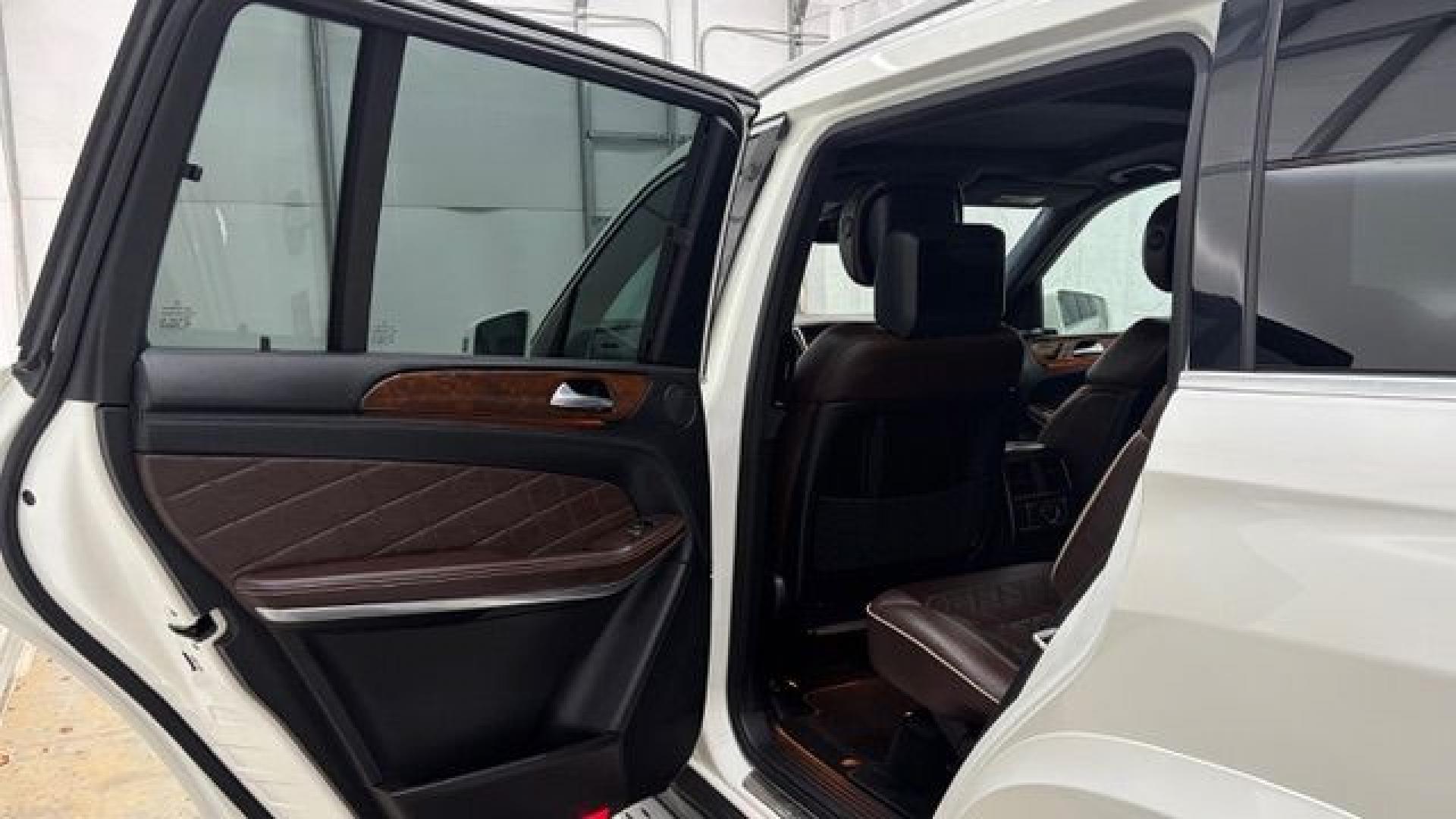 2016 White Mercedes-Benz GL 550 4MATIC (4JGDF7DE8GA) with an 4.7L V-8 gasoline direct injection engine, located at 1806 Veterans Memorial Hwy SW, Austell, GA, 30168, (770) 944-9558, 33.817959, -84.606987- Photo#13