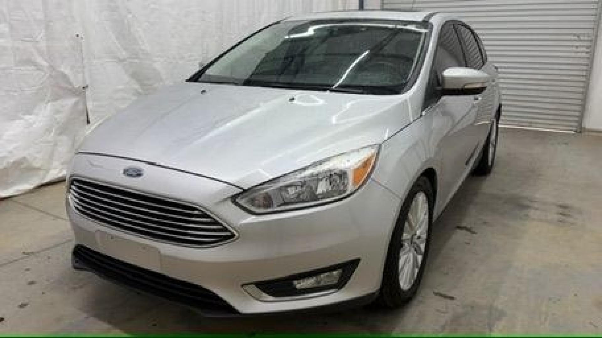2018 Silver Ford Focus Titanium (1FADP3N20JL) with an 2L I-4 gasoline direct injection engine, located at 1806 Veterans Memorial Hwy SW, Austell, GA, 30168, (770) 944-9558, 33.817959, -84.606987- Photo#0