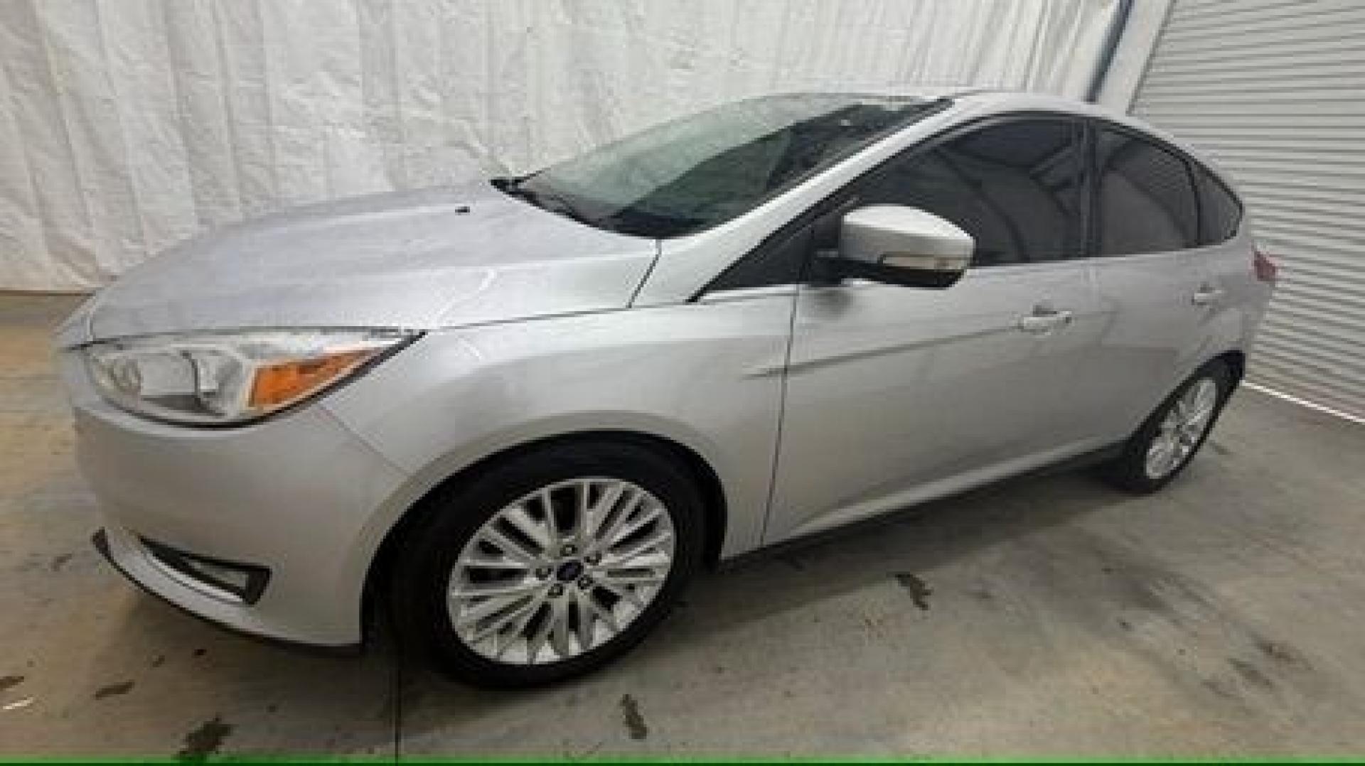 2018 Silver Ford Focus Titanium (1FADP3N20JL) with an 2L I-4 gasoline direct injection engine, located at 1806 Veterans Memorial Hwy SW, Austell, GA, 30168, (770) 944-9558, 33.817959, -84.606987- Photo#1