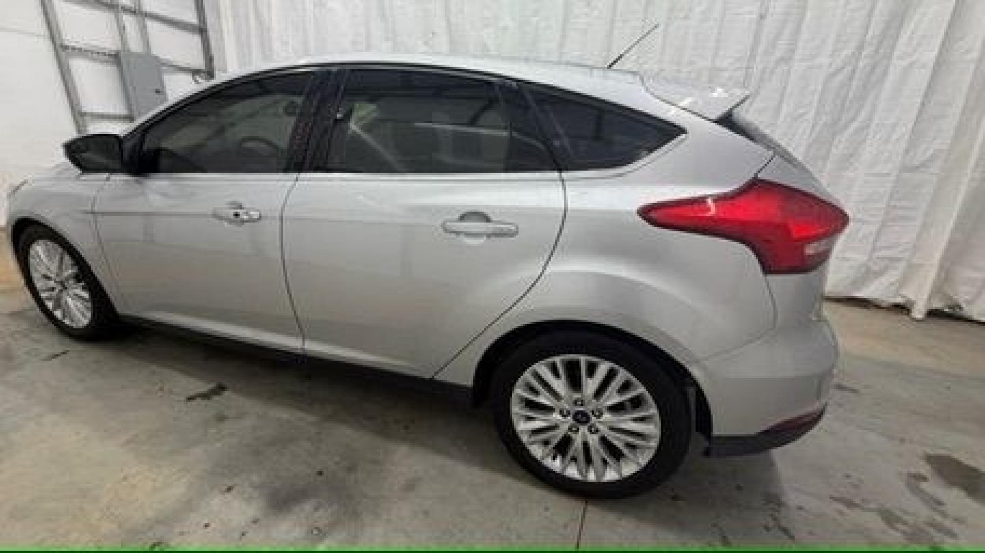 2018 Silver Ford Focus Titanium (1FADP3N20JL) with an 2L I-4 gasoline direct injection engine, located at 1806 Veterans Memorial Hwy SW, Austell, GA, 30168, (770) 944-9558, 33.817959, -84.606987- Photo#2