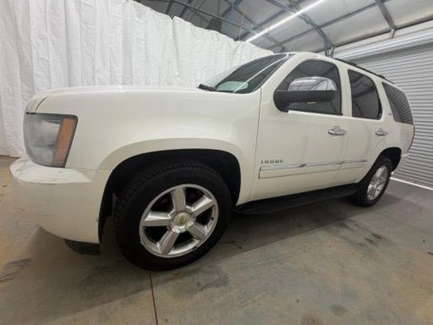 2011 White Chevrolet Tahoe LTZ (1GNSCCE05BR) with an Vortec 5.3L V-8 variable valve control engine, located at 1806 Veterans Memorial Hwy SW, Austell, GA, 30168, (770) 944-9558, 33.817959, -84.606987- Photo#1