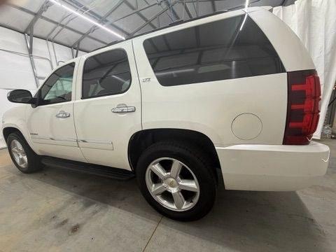 2011 White Chevrolet Tahoe LTZ (1GNSCCE05BR) with an Vortec 5.3L V-8 variable valve control engine, located at 1806 Veterans Memorial Hwy SW, Austell, GA, 30168, (770) 944-9558, 33.817959, -84.606987- Photo#2