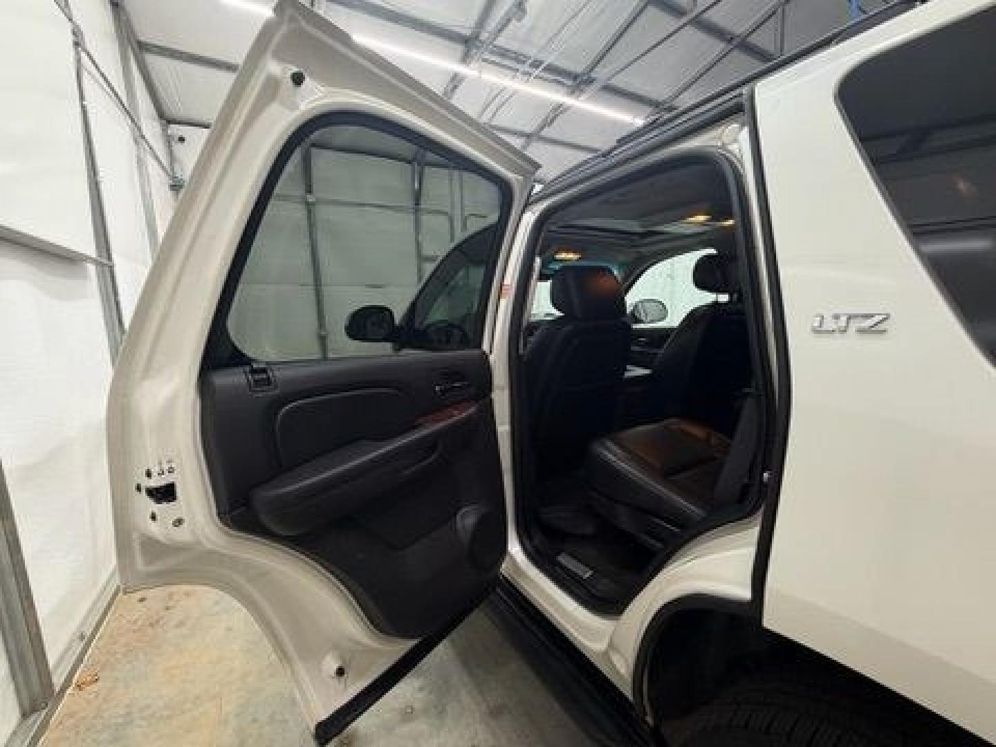 2011 White Chevrolet Tahoe LTZ (1GNSCCE05BR) with an Vortec 5.3L V-8 variable valve control engine, located at 1806 Veterans Memorial Hwy SW, Austell, GA, 30168, (770) 944-9558, 33.817959, -84.606987- Photo#8