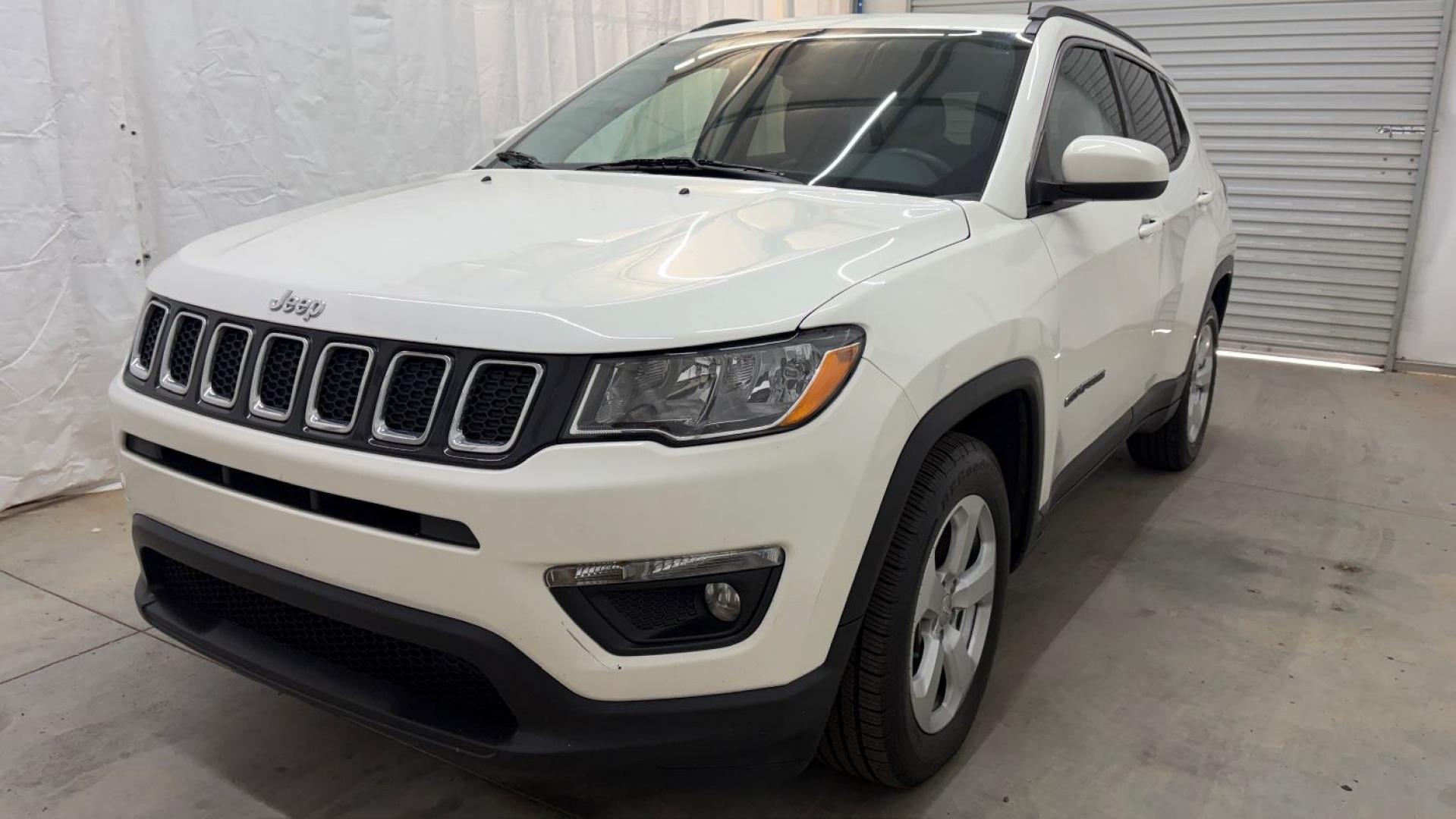 2021 White Jeep Compass Latitude FWD (3C4NJCBB2MT) with an 2.4L I-4 variable valve control engine, located at 1806 Veterans Memorial Hwy SW, Austell, GA, 30168, (770) 944-9558, 33.817959, -84.606987 - This Jeep looks good and is in good condition overall. The tires are in good shape, and the interior is impeccable. A modern, practical compact SUV that's ready for daily driving.- Photo#0