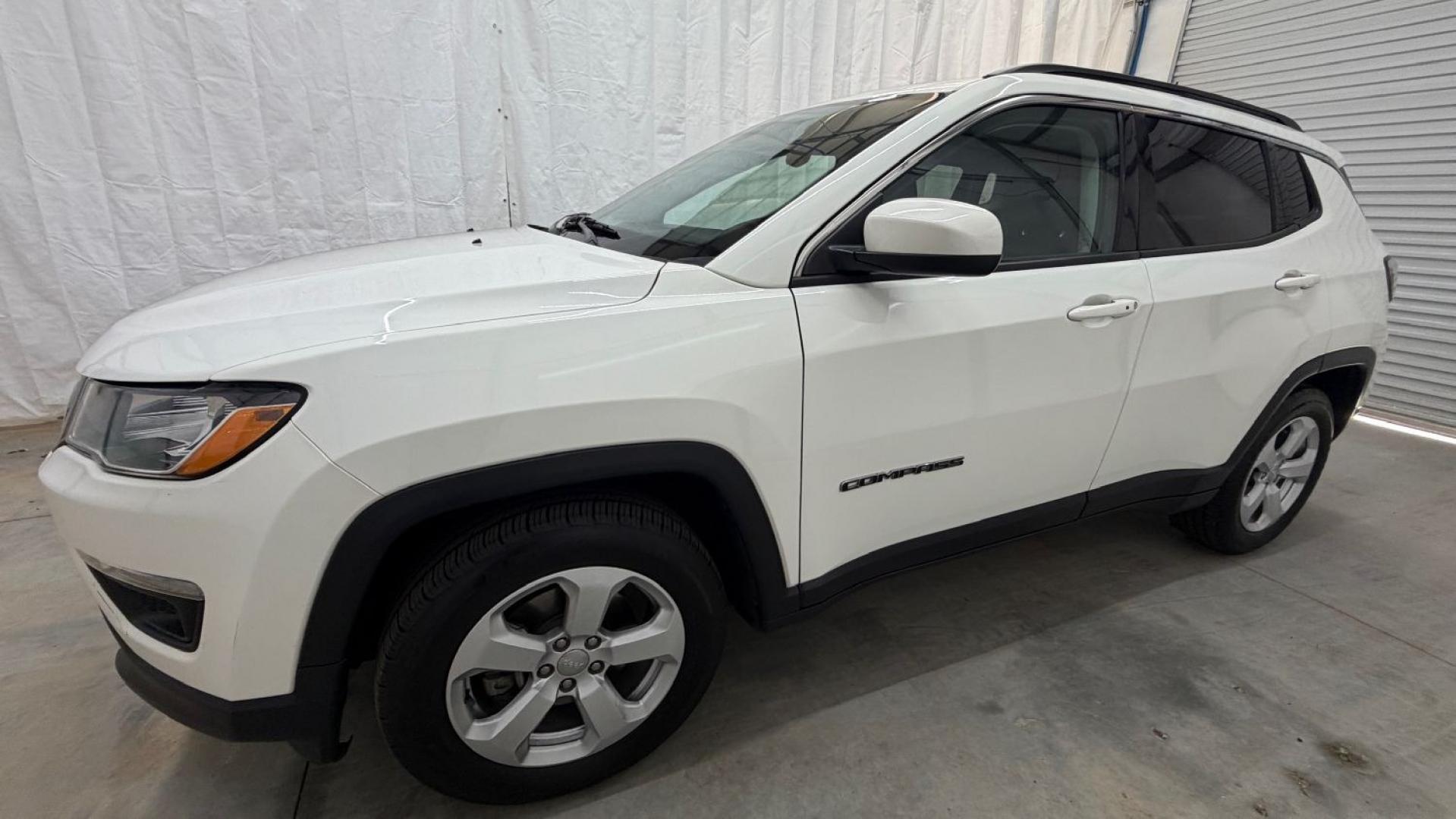 2021 White Jeep Compass Latitude FWD (3C4NJCBB2MT) with an 2.4L I-4 variable valve control engine, located at 1806 Veterans Memorial Hwy SW, Austell, GA, 30168, (770) 944-9558, 33.817959, -84.606987 - This Jeep looks good and is in good condition overall. The tires are in good shape, and the interior is impeccable. A modern, practical compact SUV that's ready for daily driving.- Photo#1