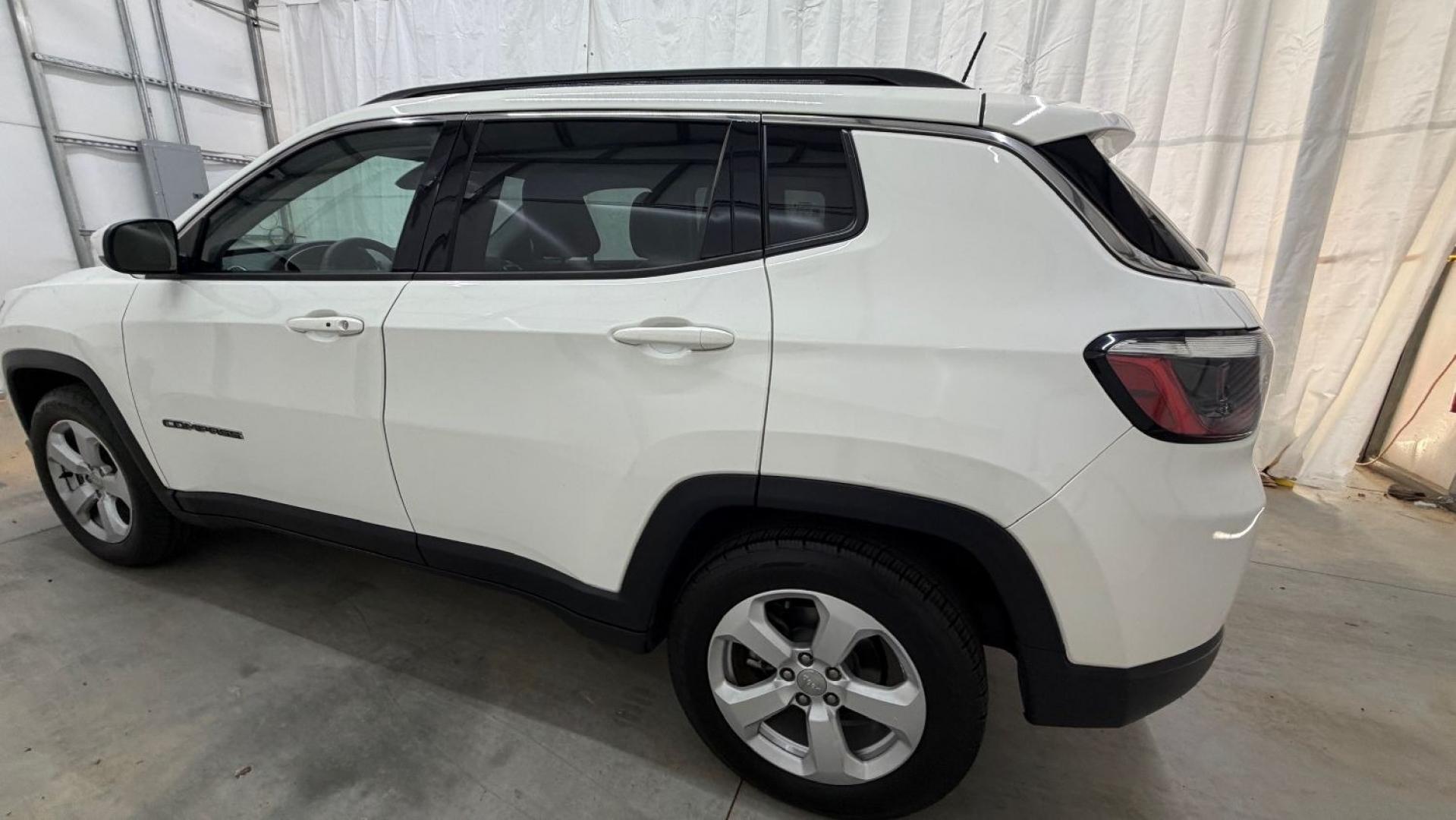 2021 White Jeep Compass Latitude FWD (3C4NJCBB2MT) with an 2.4L I-4 variable valve control engine, located at 1806 Veterans Memorial Hwy SW, Austell, GA, 30168, (770) 944-9558, 33.817959, -84.606987 - This Jeep looks good and is in good condition overall. The tires are in good shape, and the interior is impeccable. A modern, practical compact SUV that's ready for daily driving.- Photo#2