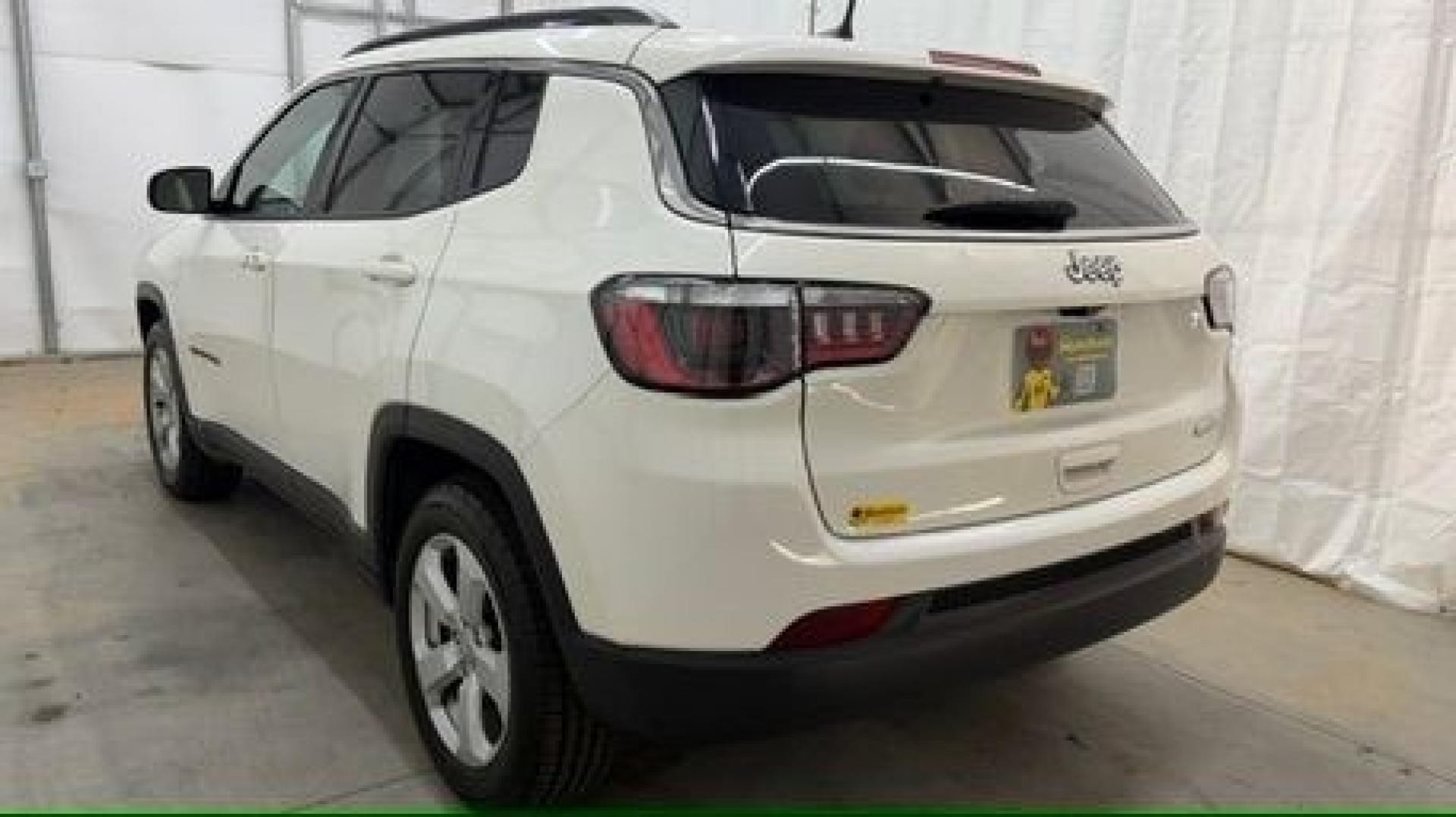 2021 White Jeep Compass Latitude FWD (3C4NJCBB2MT) with an 2.4L I-4 variable valve control engine, located at 1806 Veterans Memorial Hwy SW, Austell, GA, 30168, (770) 944-9558, 33.817959, -84.606987 - This Jeep looks good and is in good condition overall. The tires are in good shape, and the interior is impeccable. A modern, practical compact SUV that's ready for daily driving.- Photo#3