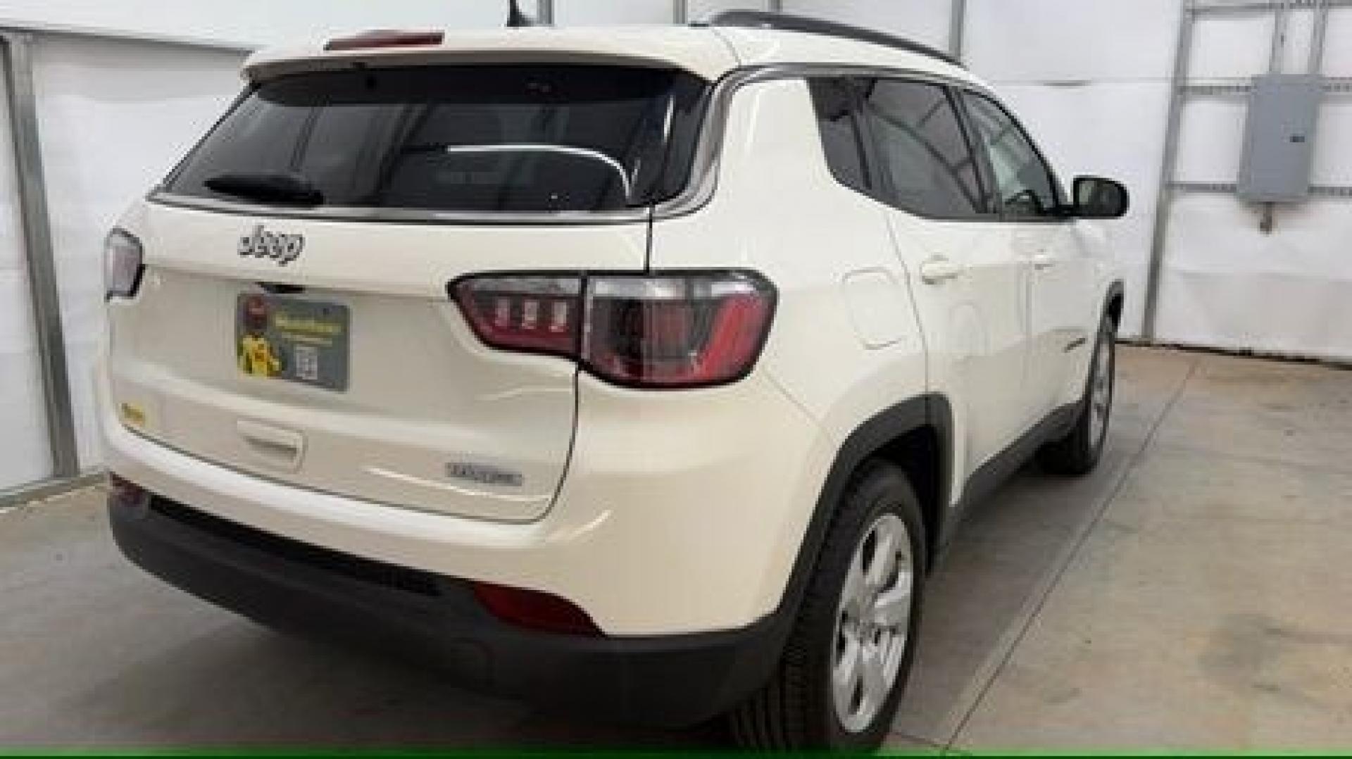 2021 White Jeep Compass Latitude FWD (3C4NJCBB2MT) with an 2.4L I-4 variable valve control engine, located at 1806 Veterans Memorial Hwy SW, Austell, GA, 30168, (770) 944-9558, 33.817959, -84.606987 - This Jeep looks good and is in good condition overall. The tires are in good shape, and the interior is impeccable. A modern, practical compact SUV that's ready for daily driving.- Photo#6