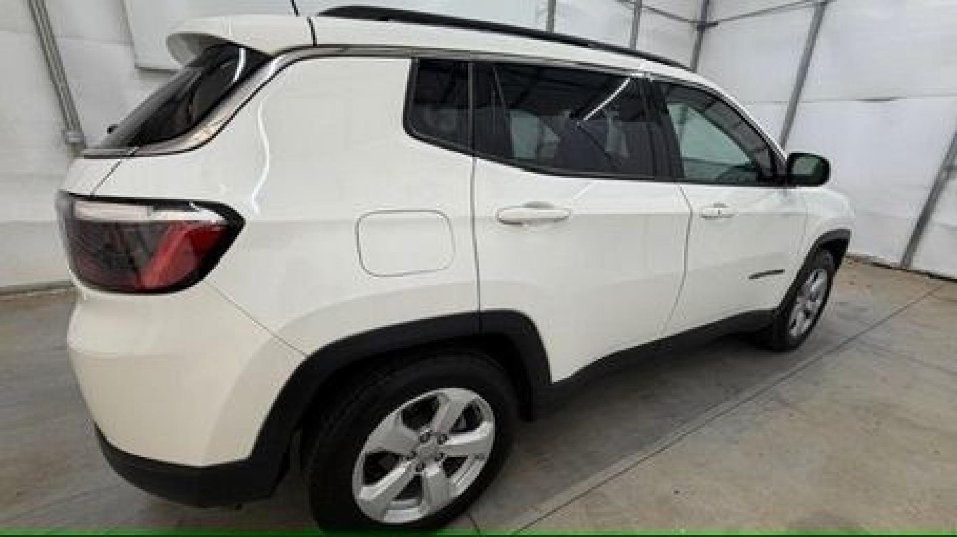 2021 White Jeep Compass Latitude FWD (3C4NJCBB2MT) with an 2.4L I-4 variable valve control engine, located at 1806 Veterans Memorial Hwy SW, Austell, GA, 30168, (770) 944-9558, 33.817959, -84.606987 - This Jeep looks good and is in good condition overall. The tires are in good shape, and the interior is impeccable. A modern, practical compact SUV that's ready for daily driving.- Photo#7