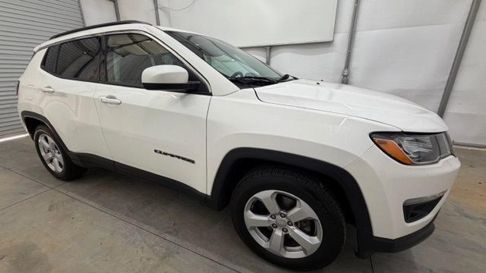 2021 White Jeep Compass Latitude FWD (3C4NJCBB2MT) with an 2.4L I-4 variable valve control engine, located at 1806 Veterans Memorial Hwy SW, Austell, GA, 30168, (770) 944-9558, 33.817959, -84.606987 - This Jeep looks good and is in good condition overall. The tires are in good shape, and the interior is impeccable. A modern, practical compact SUV that's ready for daily driving.- Photo#8