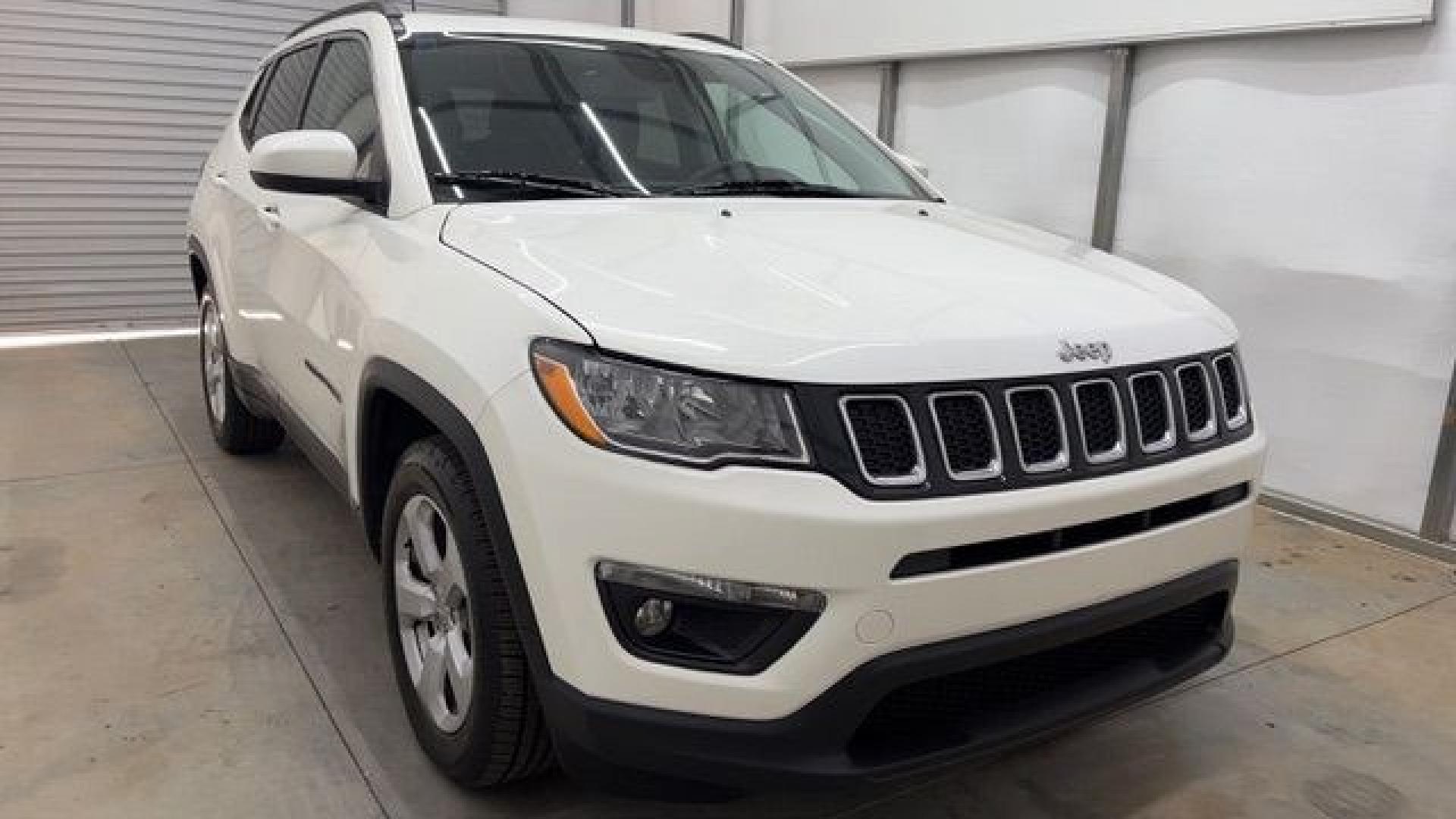 2021 White Jeep Compass Latitude FWD (3C4NJCBB2MT) with an 2.4L I-4 variable valve control engine, located at 1806 Veterans Memorial Hwy SW, Austell, GA, 30168, (770) 944-9558, 33.817959, -84.606987 - This Jeep looks good and is in good condition overall. The tires are in good shape, and the interior is impeccable. A modern, practical compact SUV that's ready for daily driving.- Photo#9