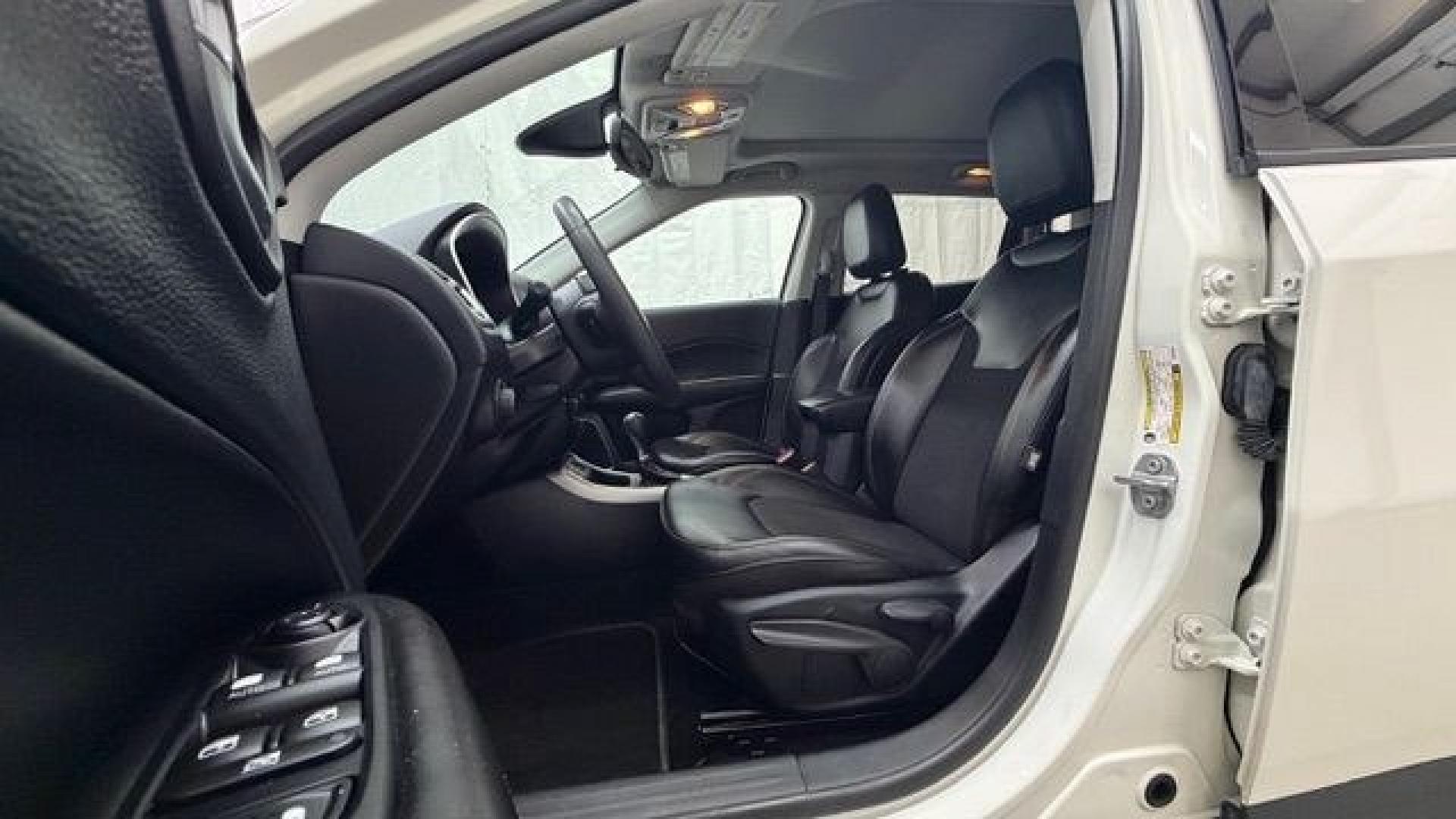 2021 White Jeep Compass Latitude FWD (3C4NJCBB2MT) with an 2.4L I-4 variable valve control engine, located at 1806 Veterans Memorial Hwy SW, Austell, GA, 30168, (770) 944-9558, 33.817959, -84.606987 - This Jeep looks good and is in good condition overall. The tires are in good shape, and the interior is impeccable. A modern, practical compact SUV that's ready for daily driving.- Photo#13