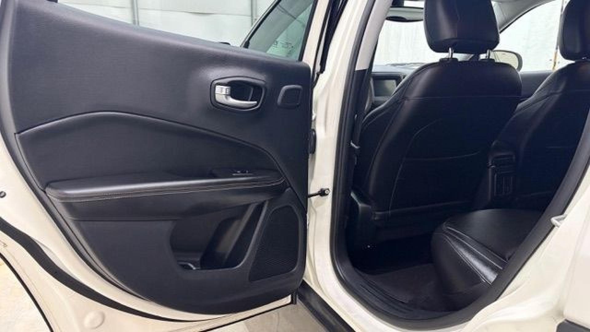 2021 White Jeep Compass Latitude FWD (3C4NJCBB2MT) with an 2.4L I-4 variable valve control engine, located at 1806 Veterans Memorial Hwy SW, Austell, GA, 30168, (770) 944-9558, 33.817959, -84.606987 - This Jeep looks good and is in good condition overall. The tires are in good shape, and the interior is impeccable. A modern, practical compact SUV that's ready for daily driving.- Photo#14