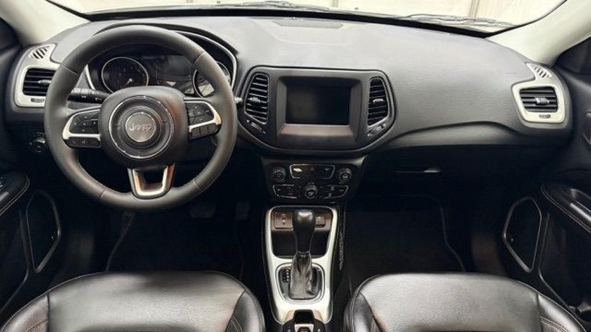 2021 White Jeep Compass Latitude FWD (3C4NJCBB2MT) with an 2.4L I-4 variable valve control engine, located at 1806 Veterans Memorial Hwy SW, Austell, GA, 30168, (770) 944-9558, 33.817959, -84.606987 - This Jeep looks good and is in good condition overall. The tires are in good shape, and the interior is impeccable. A modern, practical compact SUV that's ready for daily driving.- Photo#16